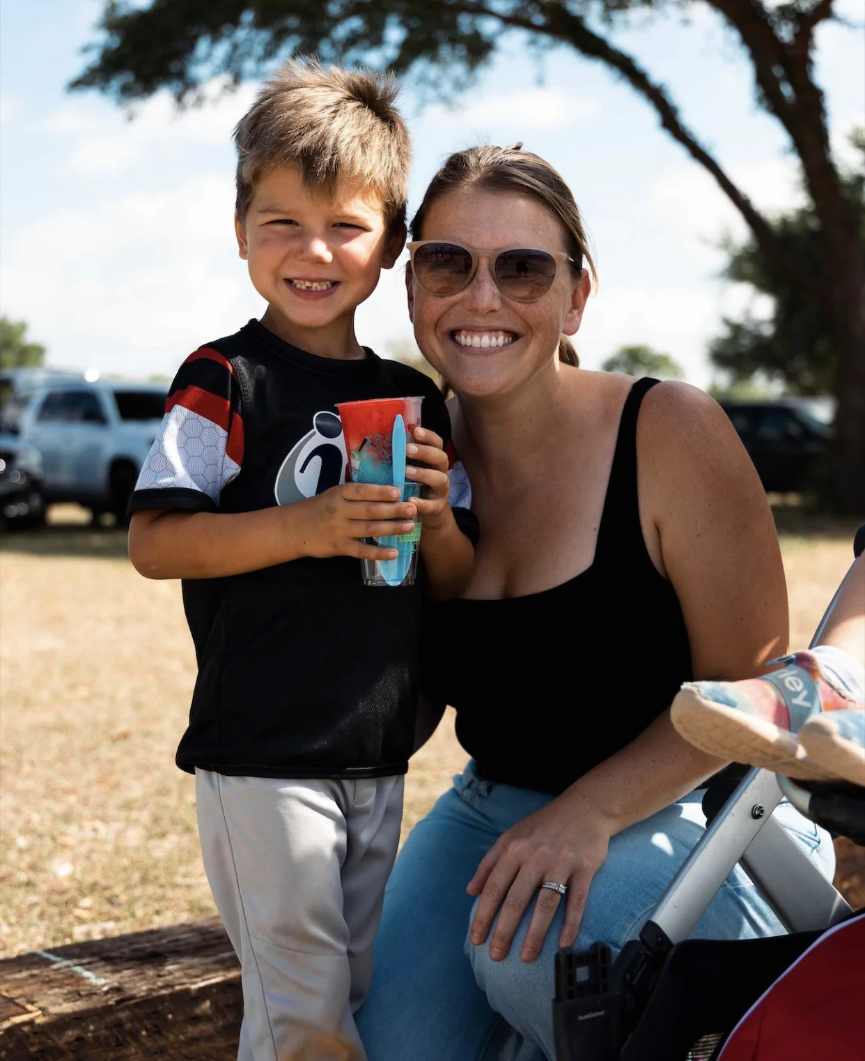 mom and son with strawberry and blueberry Italian ice