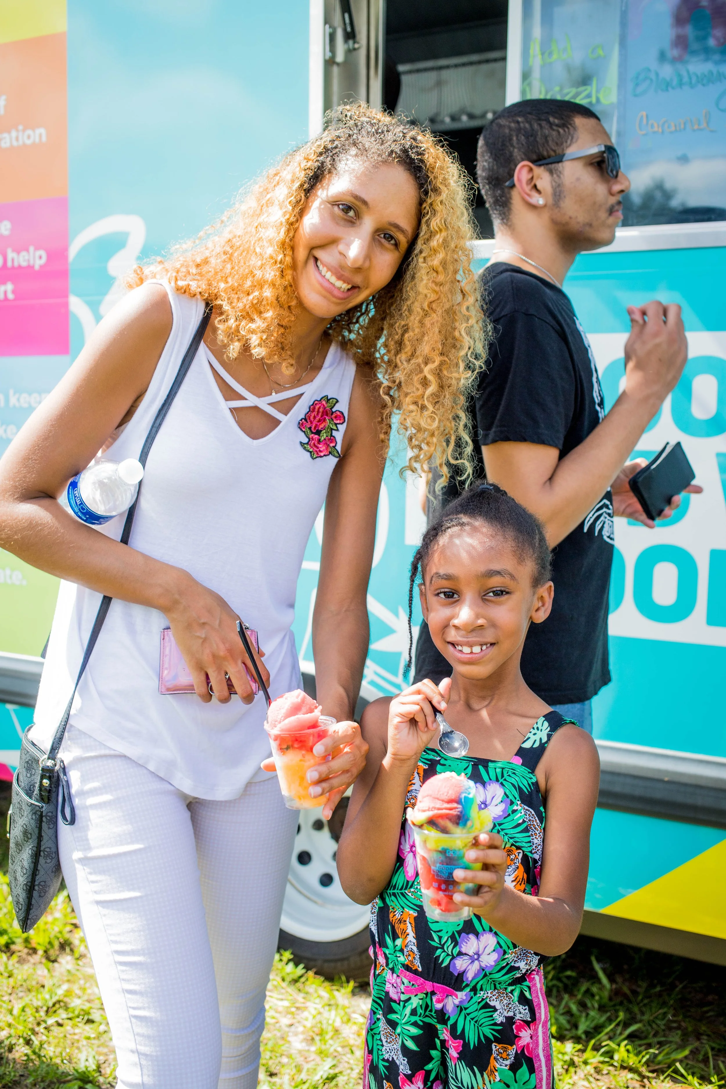 mother and daughter with Domi Italian Ice at community festival