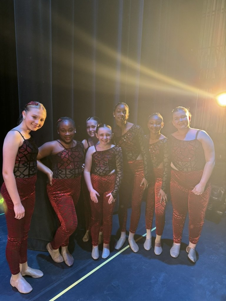 Dancers back stage having fun before performing at recital