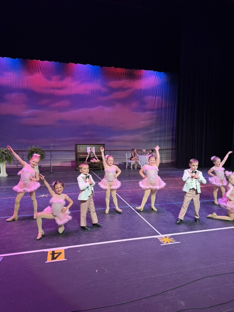 young tap dancers hitting their final pose
