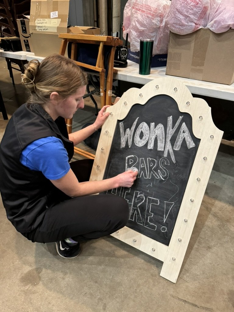 Dance teacher working on props for recital