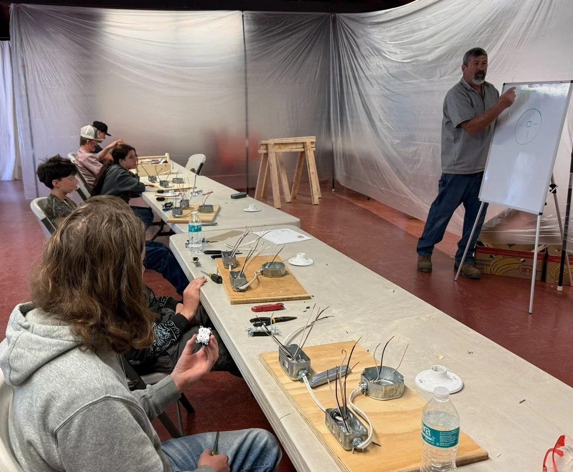 Students learning together in a classroom workshop · Magnolia programs