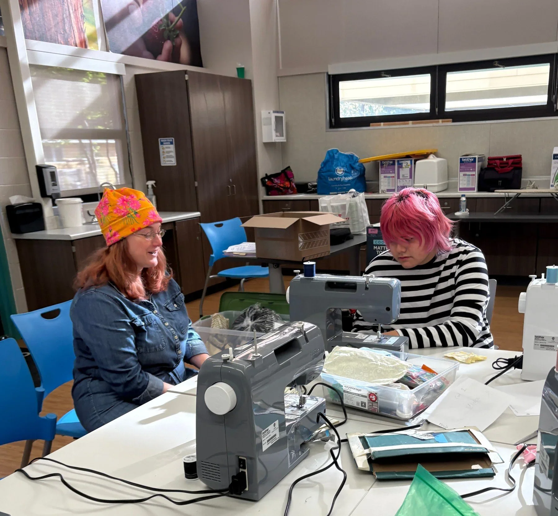 Students working on textile projects at classroom tables · Magnolia programs
