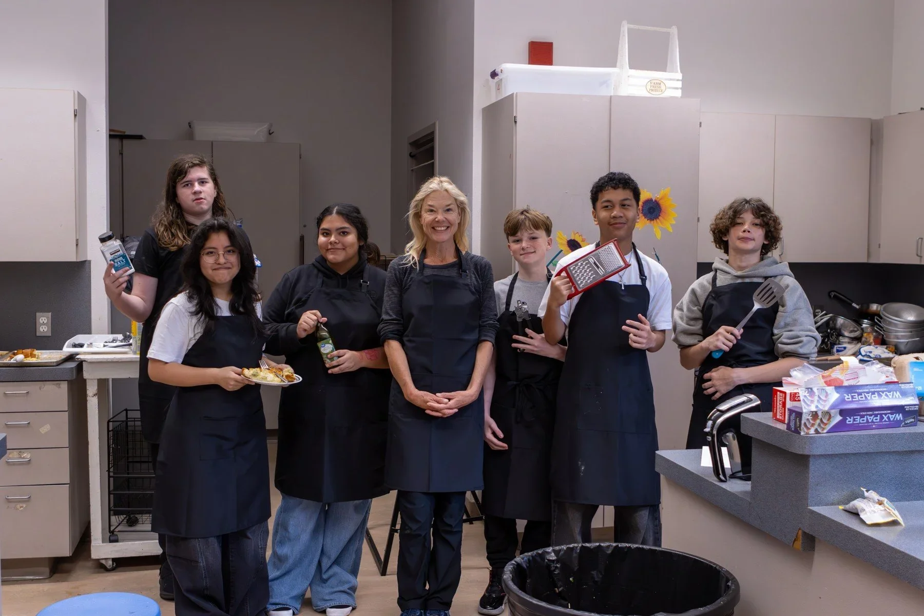 Students and mentors together in a teaching kitchen