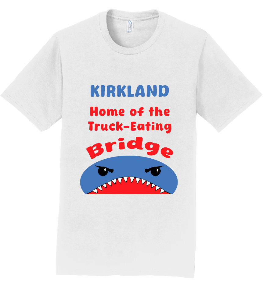 A white cotton t-shirt with a text that reads "Kirkland Home of the Truck-Eating Bridge". Below is an illustration of what looks to be a hungry shark.