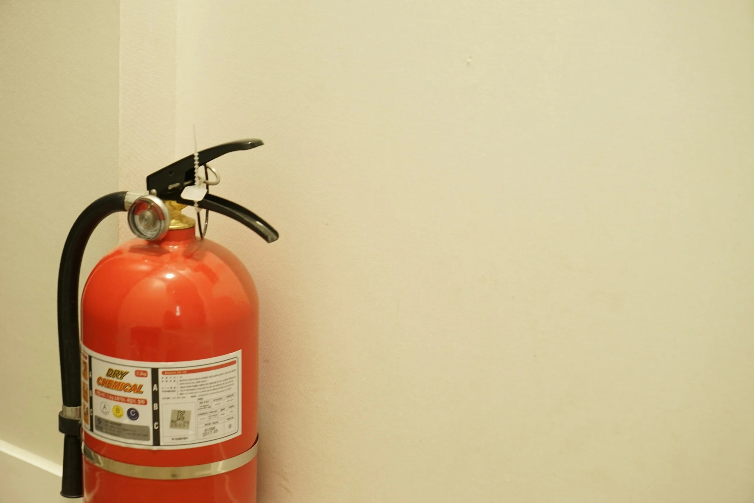 Smoke Detector Pro servicing a Fire extinguisher Clayton MO