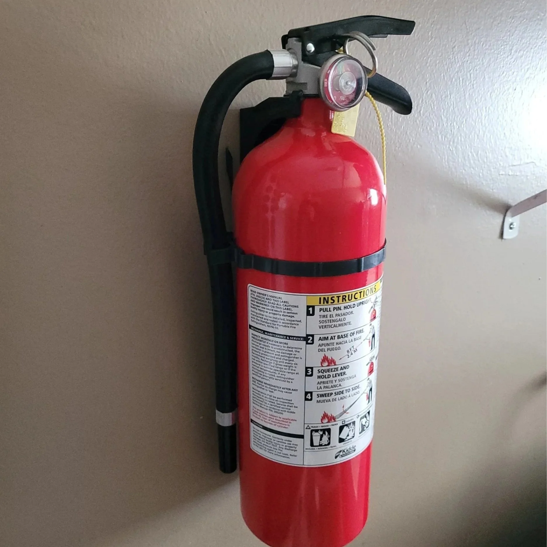 ABC fire extinguisher mounted on commercial building