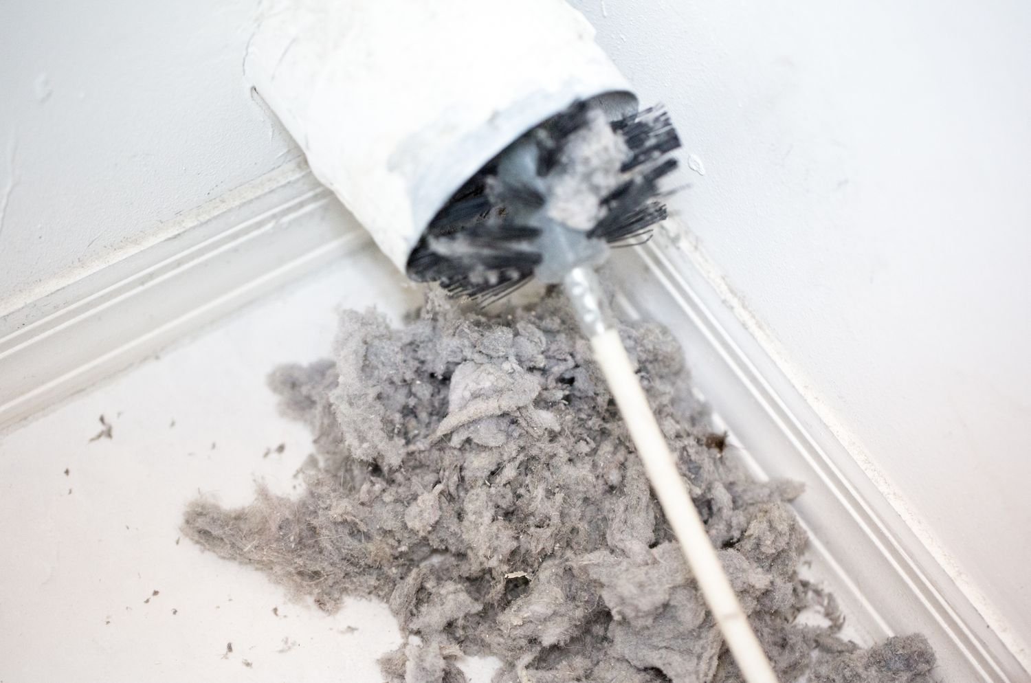 Smoke Detector Pro servicing Dryer vent cleaning and lots of lint coming out