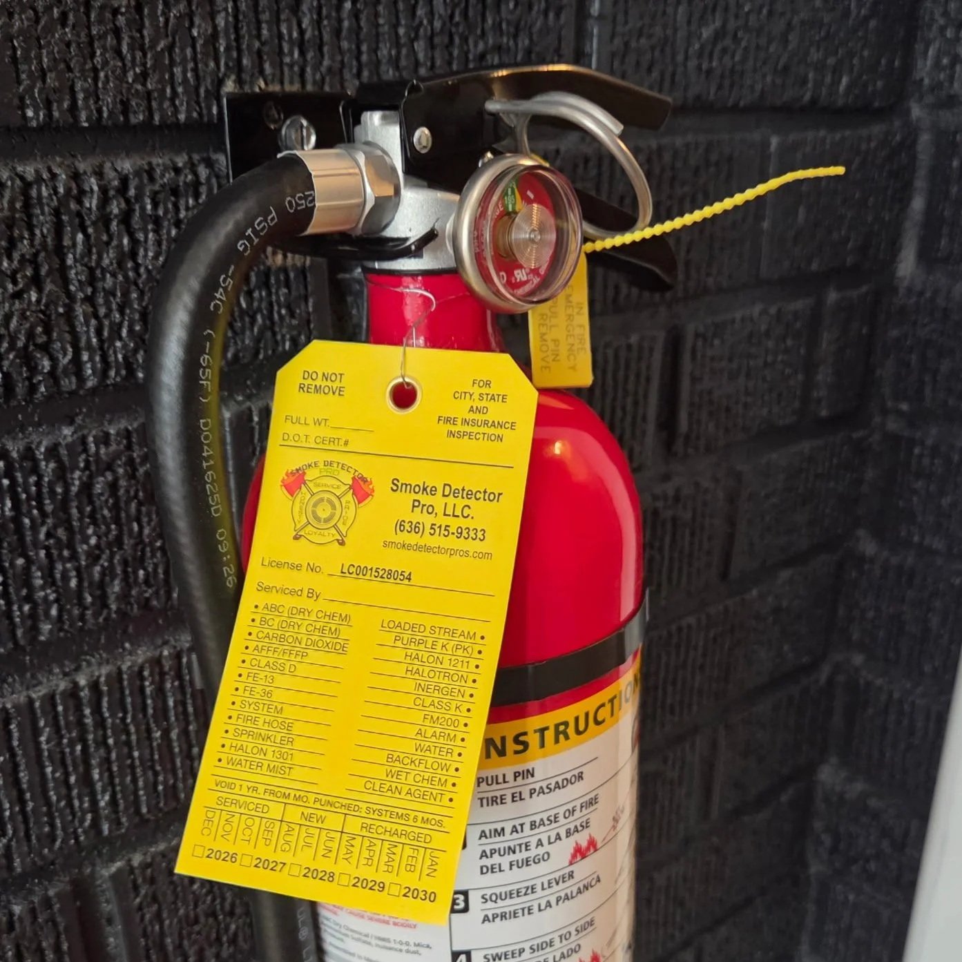 Servicing Fire Extinguisher picture