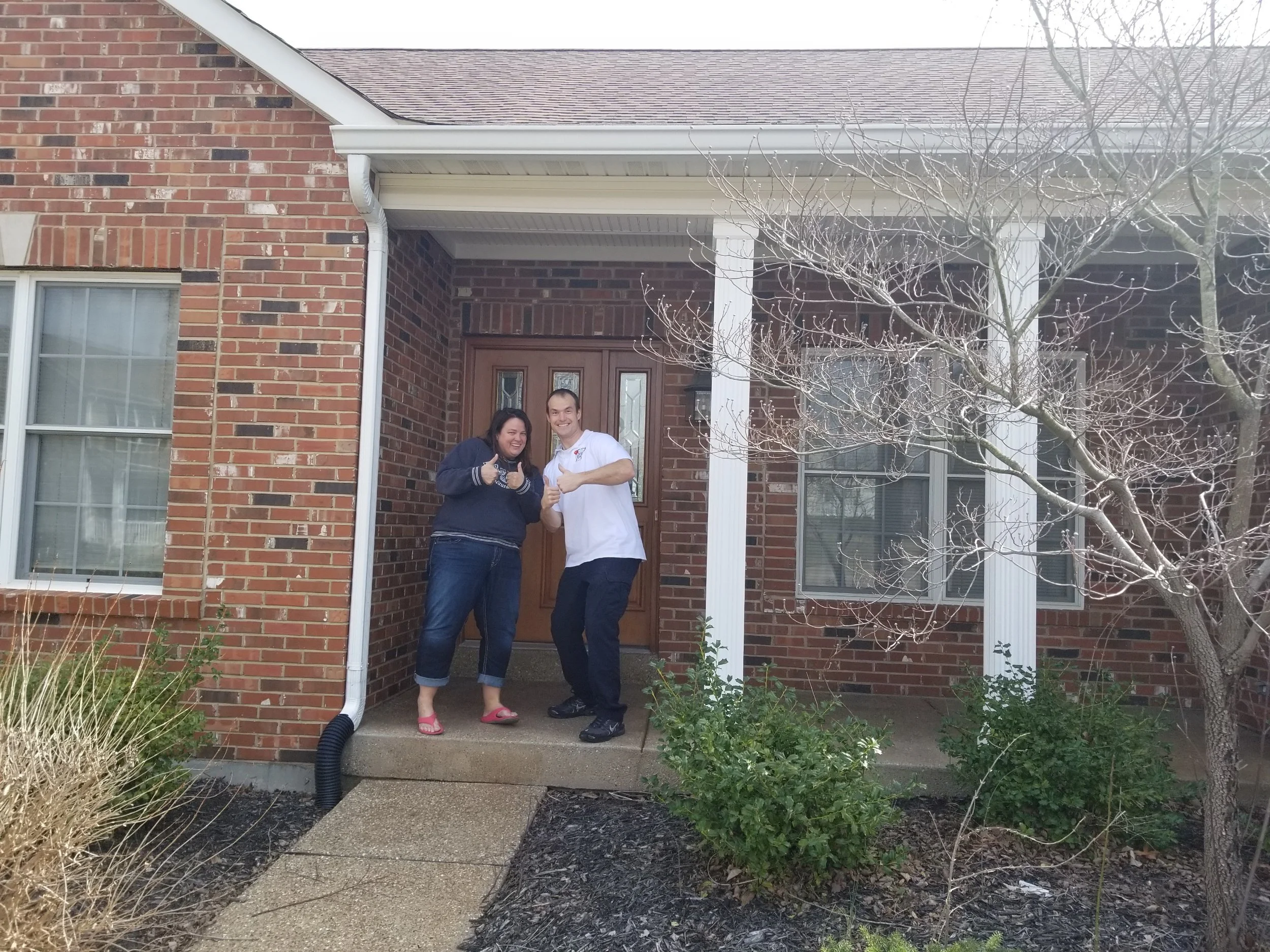 residential neighborhood in St. Charles County MO fire safety with owner Smoke Detector Pro with customer at their home