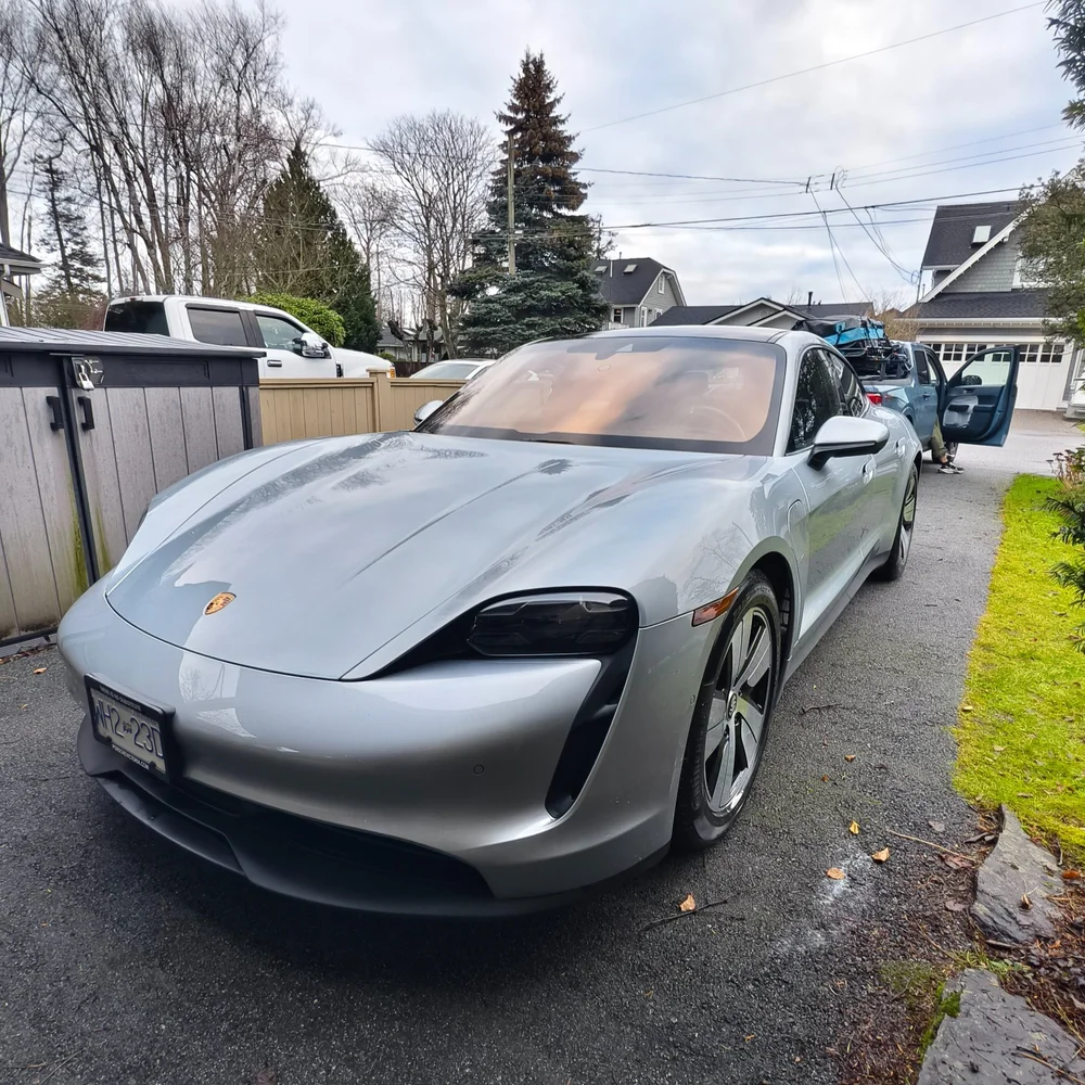 Silver Porsche Taycan on a driveway