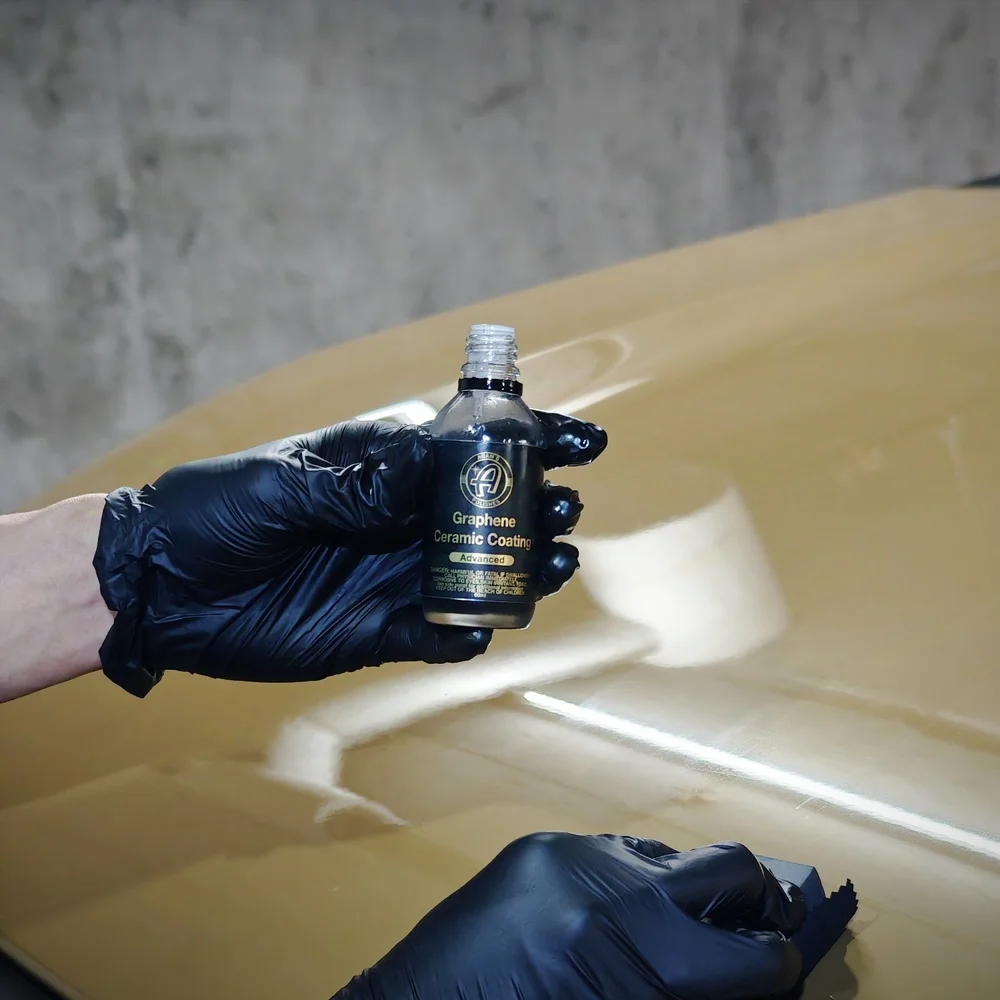 Gloved hands and coating product during a protective-finish project