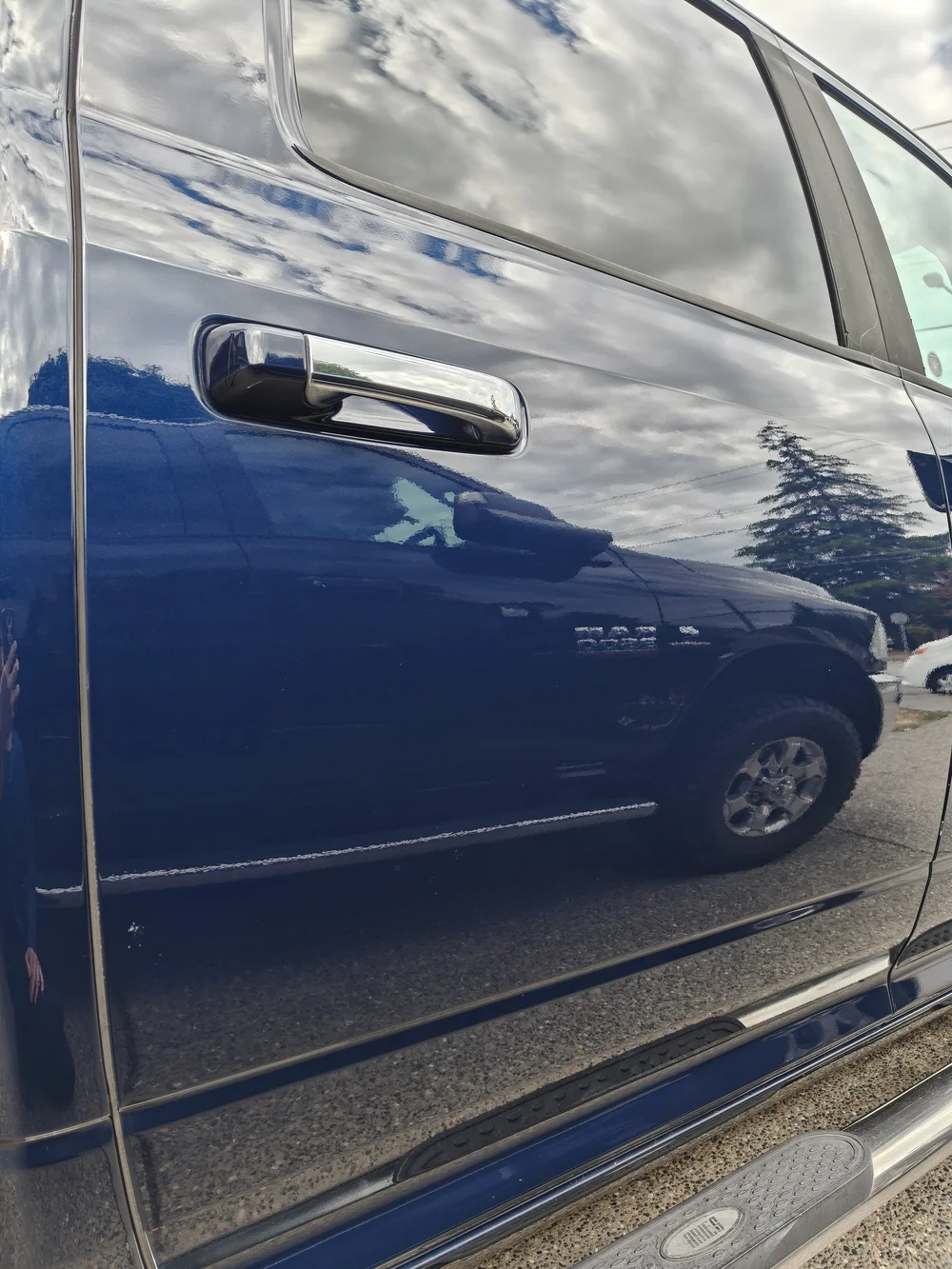 After paint correction: blue vehicle door finish