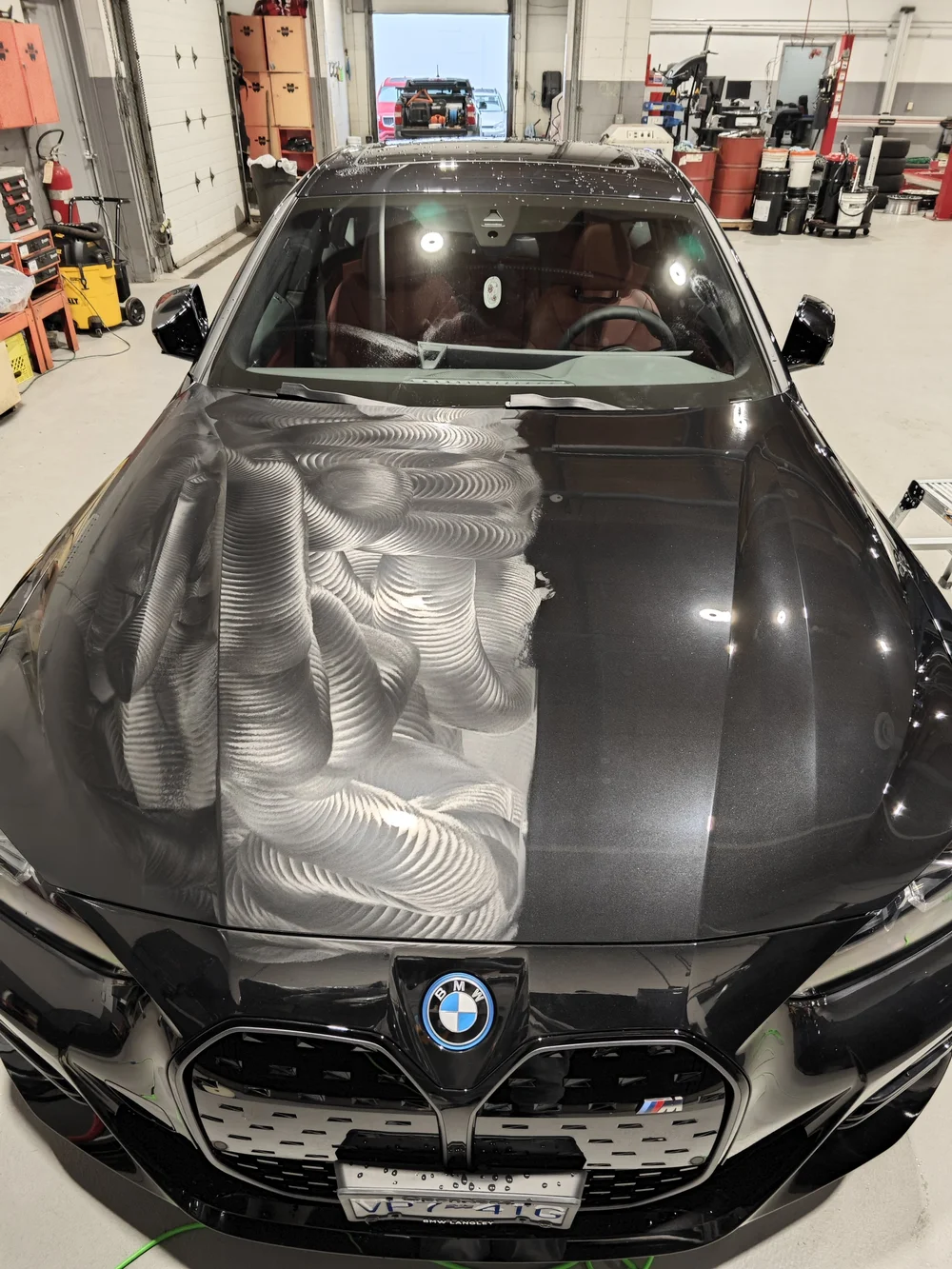BMW hood during paint preparation and polishing