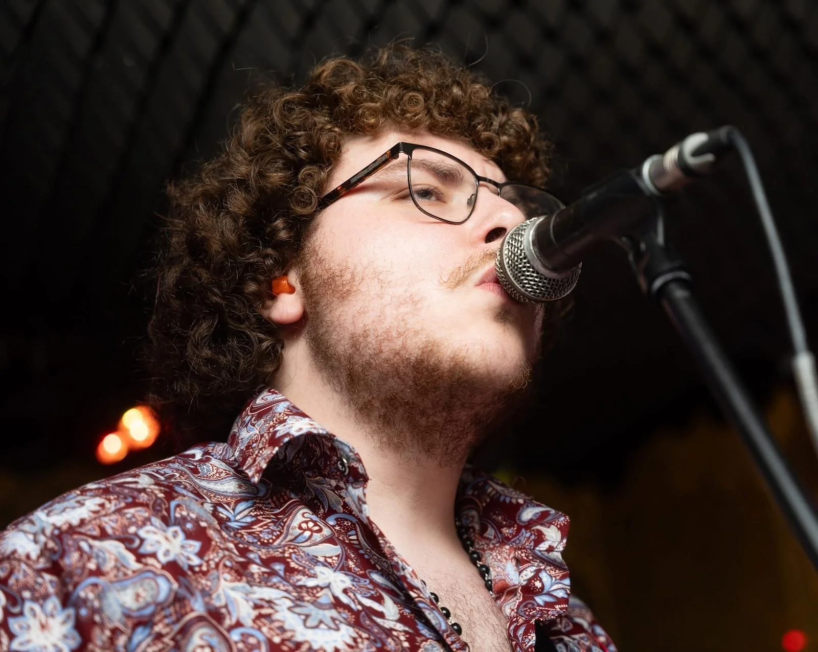 Alfie Wickins singing backing vocals with Monumental