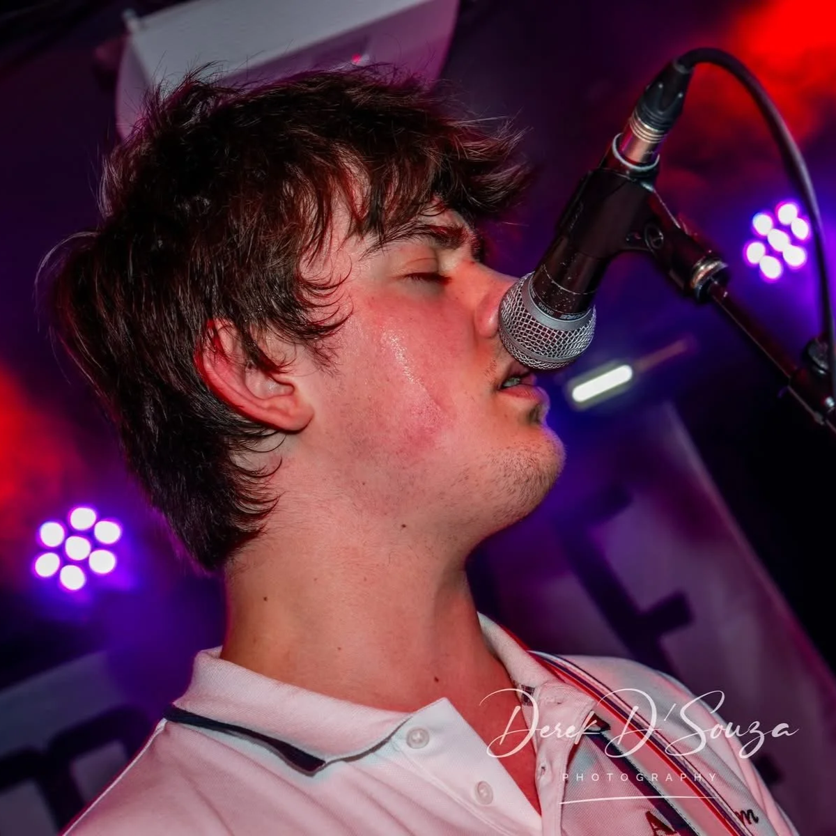 Finn Sexton Singing on stage with Monumental