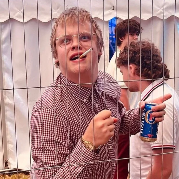 Denny Keil smoking and drinking backstage at Mersea Island Festival with Monumental