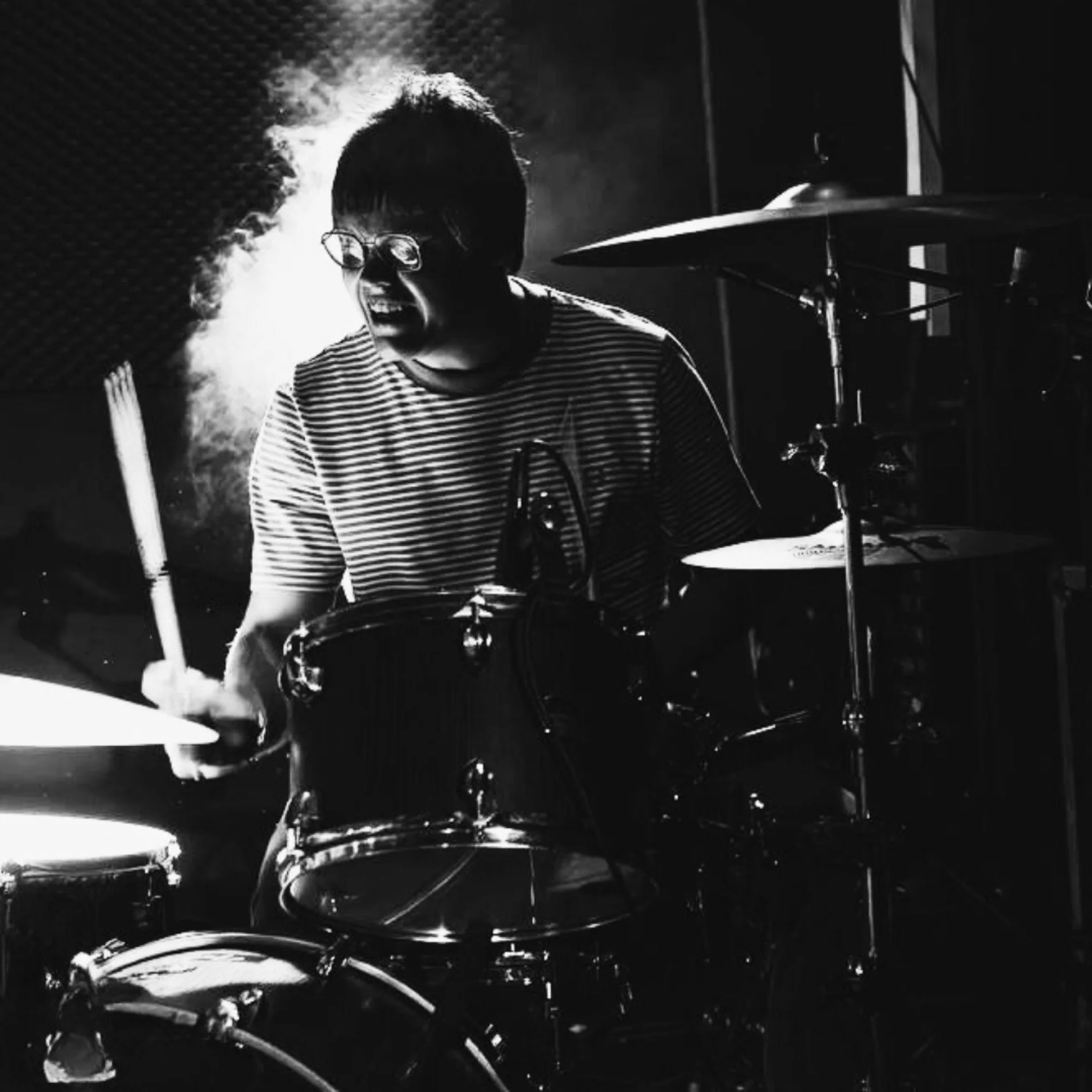Denny Keil creating smoke on the drumkit with Monumental