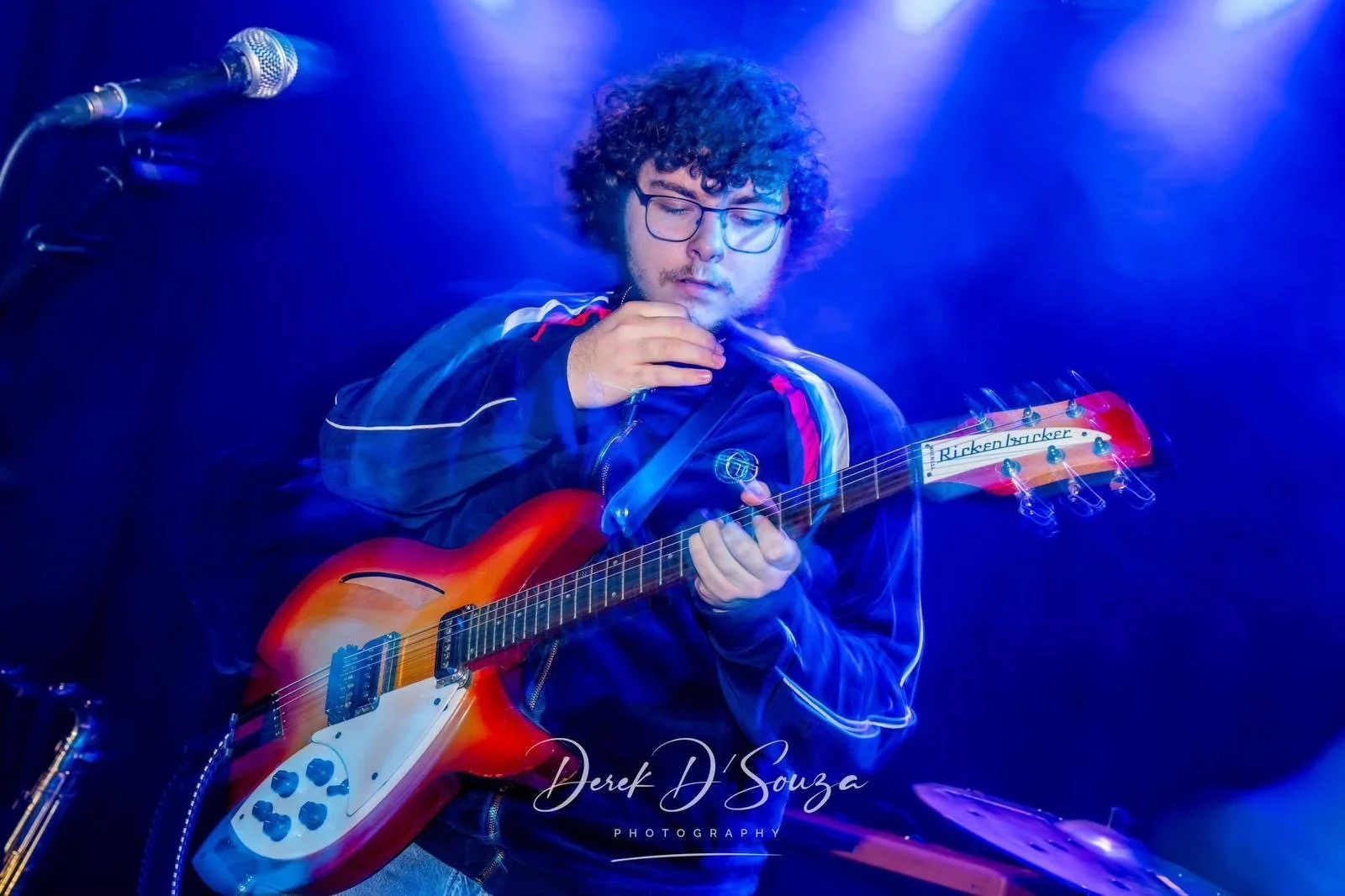 Alfie Wickins on stage with Monumental playing lead guitar