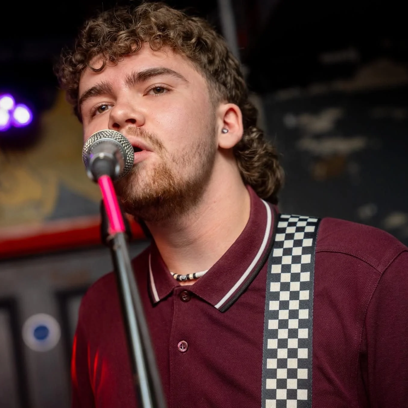 Nathan Bennett singing on stage with Monumental