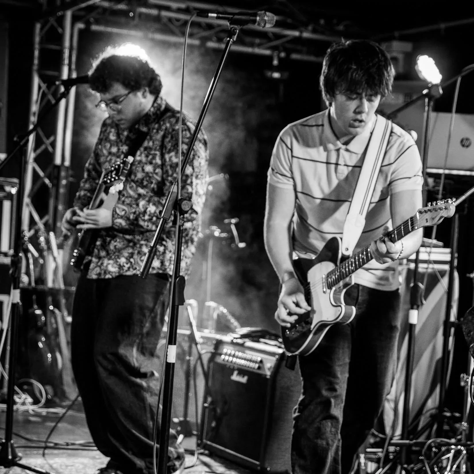 Alfie Wickins and Finn Sexton on stage with Monumental playing guitars