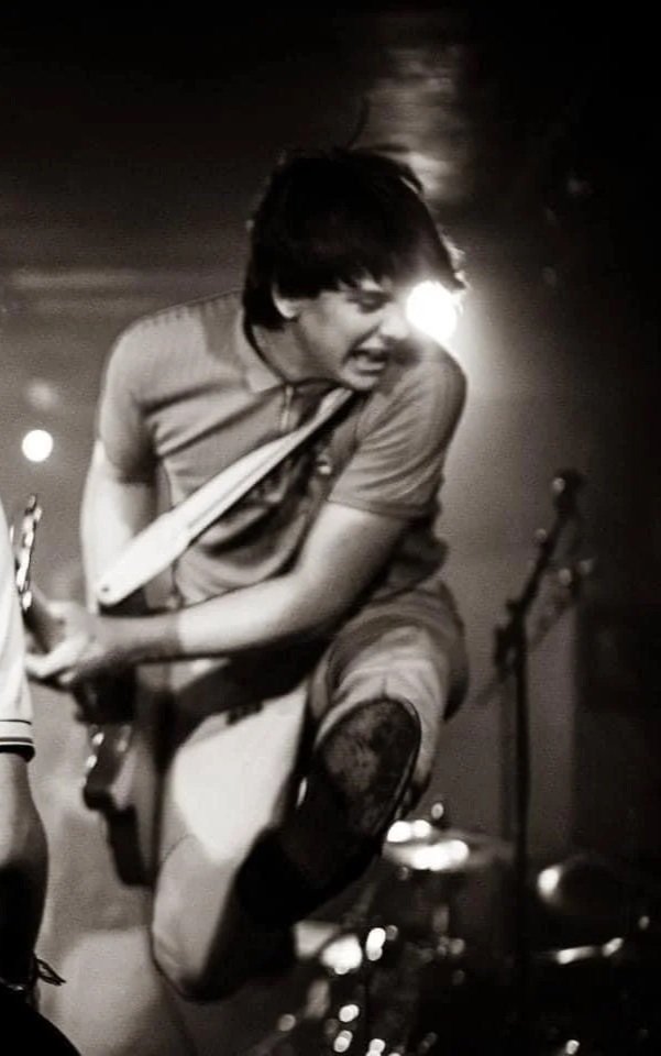 Finn Sexton jumping on stage with Monumental