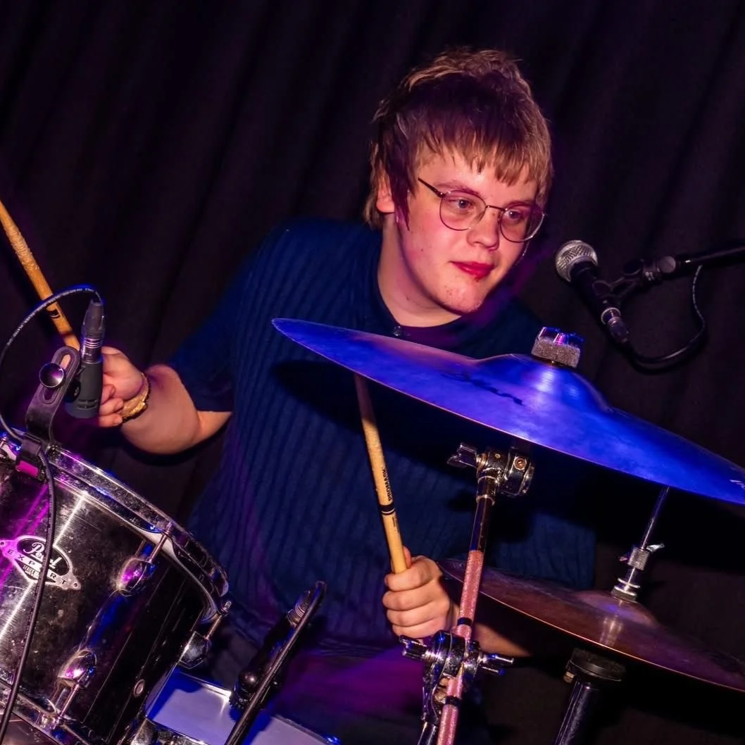 Denny Drumming on stage with Monumental
