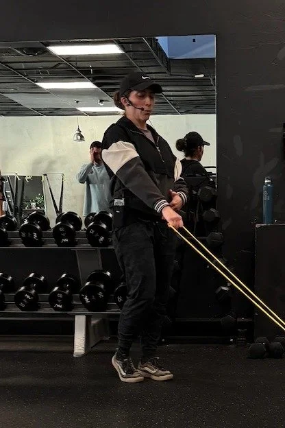 Lauren, personal trainer at Lift Fitness Studio in Bend, coaching a resistance band exercise