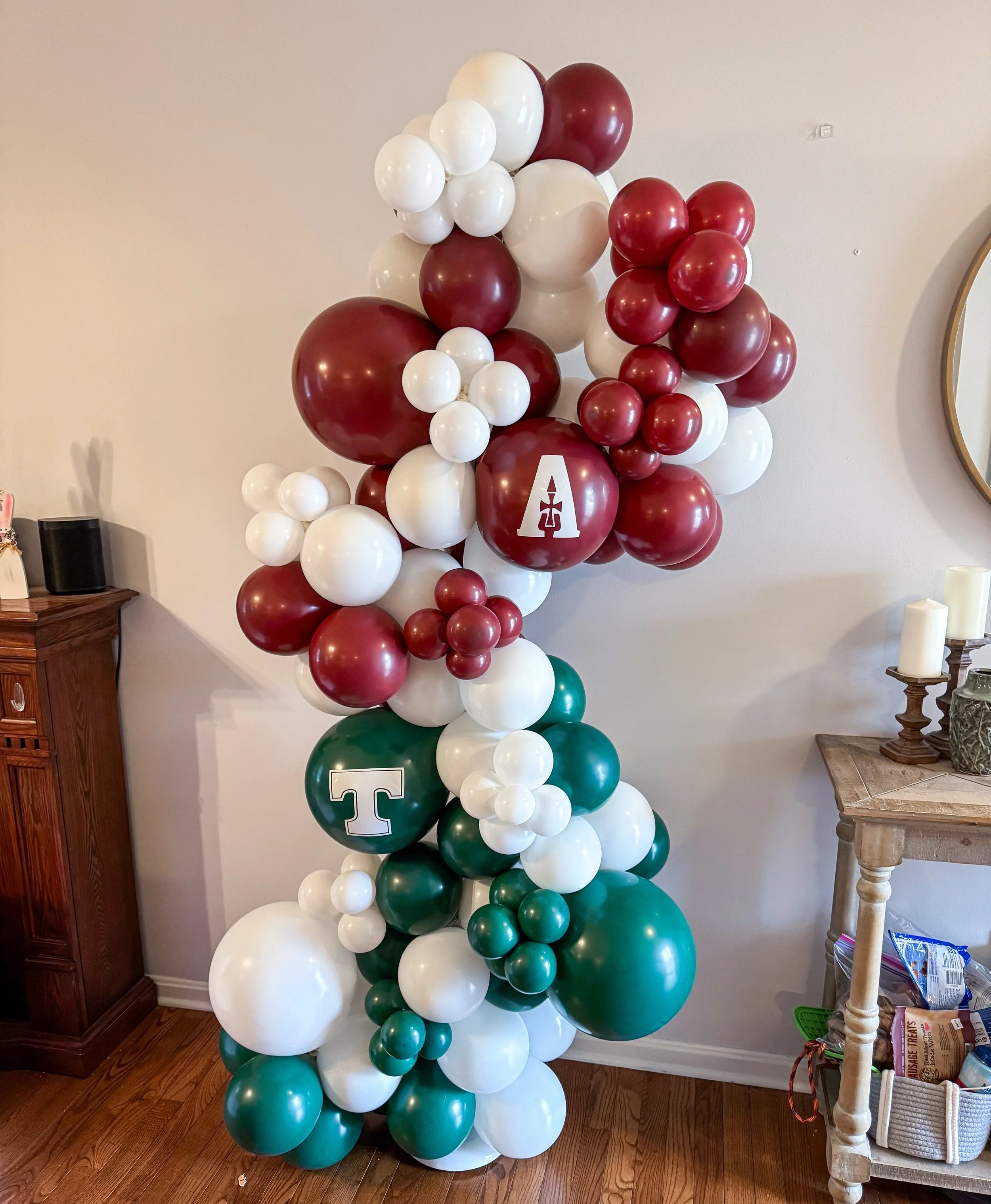 A joint graduation party? No problem! I love how this freestanding garland turned out for two Trinity and assumption graduates! 

#louisvilleballoondecor #louisvilleballoons #balloondecor #graduationparty #graduationballoons