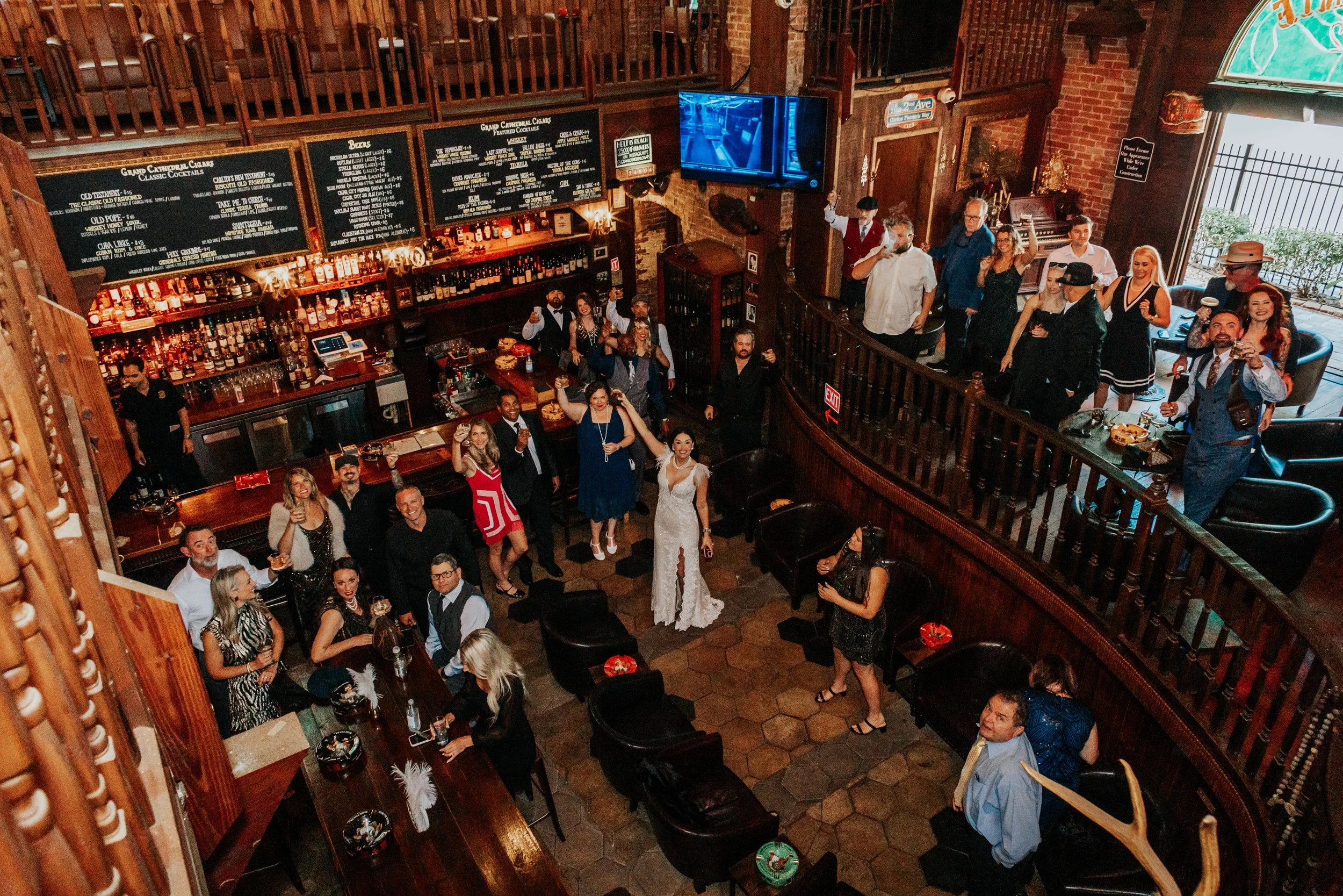 guests celebrating during a wedding reception at grand cathedral cigars in tampa, florida