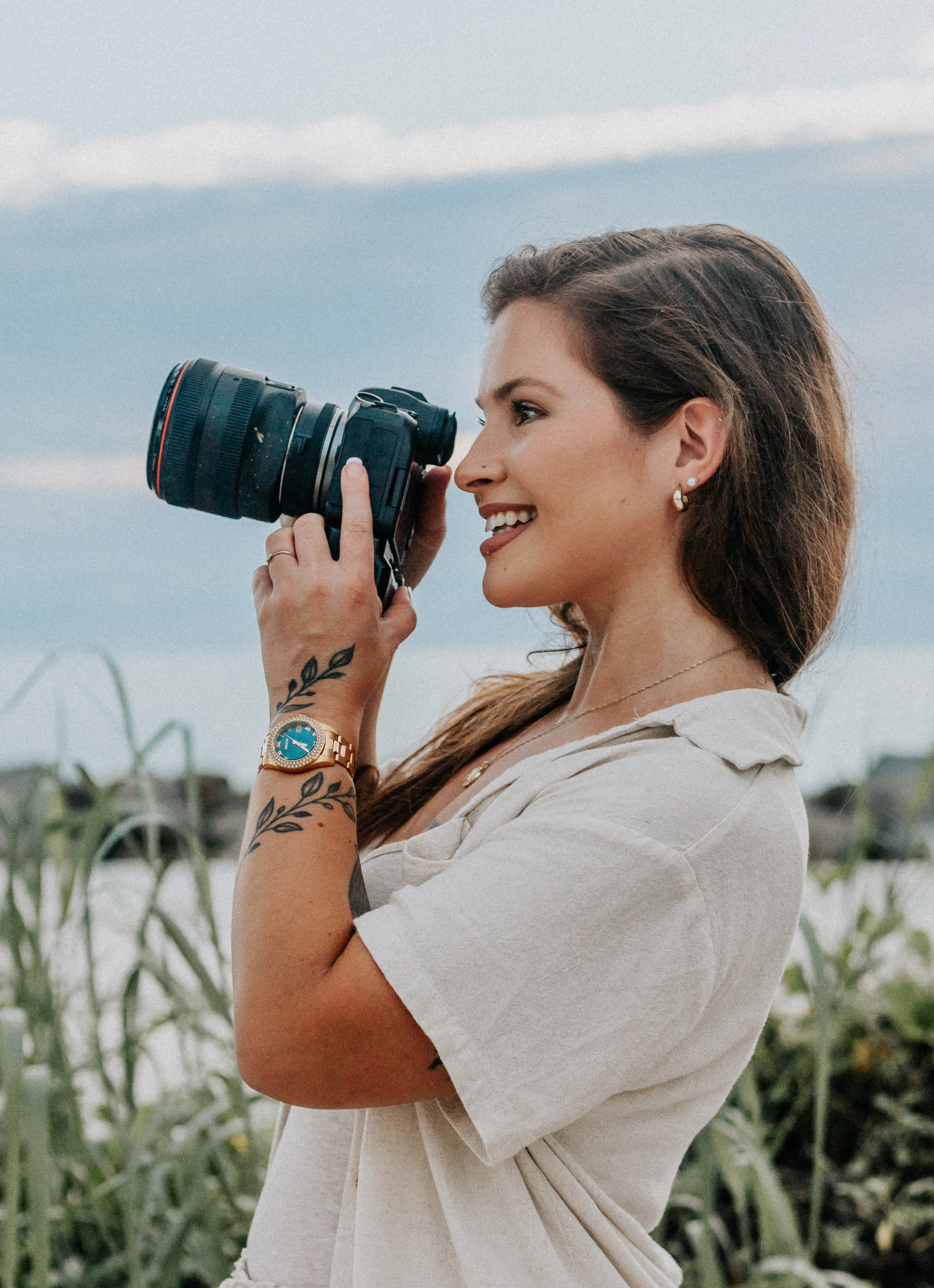 Hi, I'm Noelle. This photo is of me with my camera, I'm a Tampa based photographer and I specialize in storytelling!