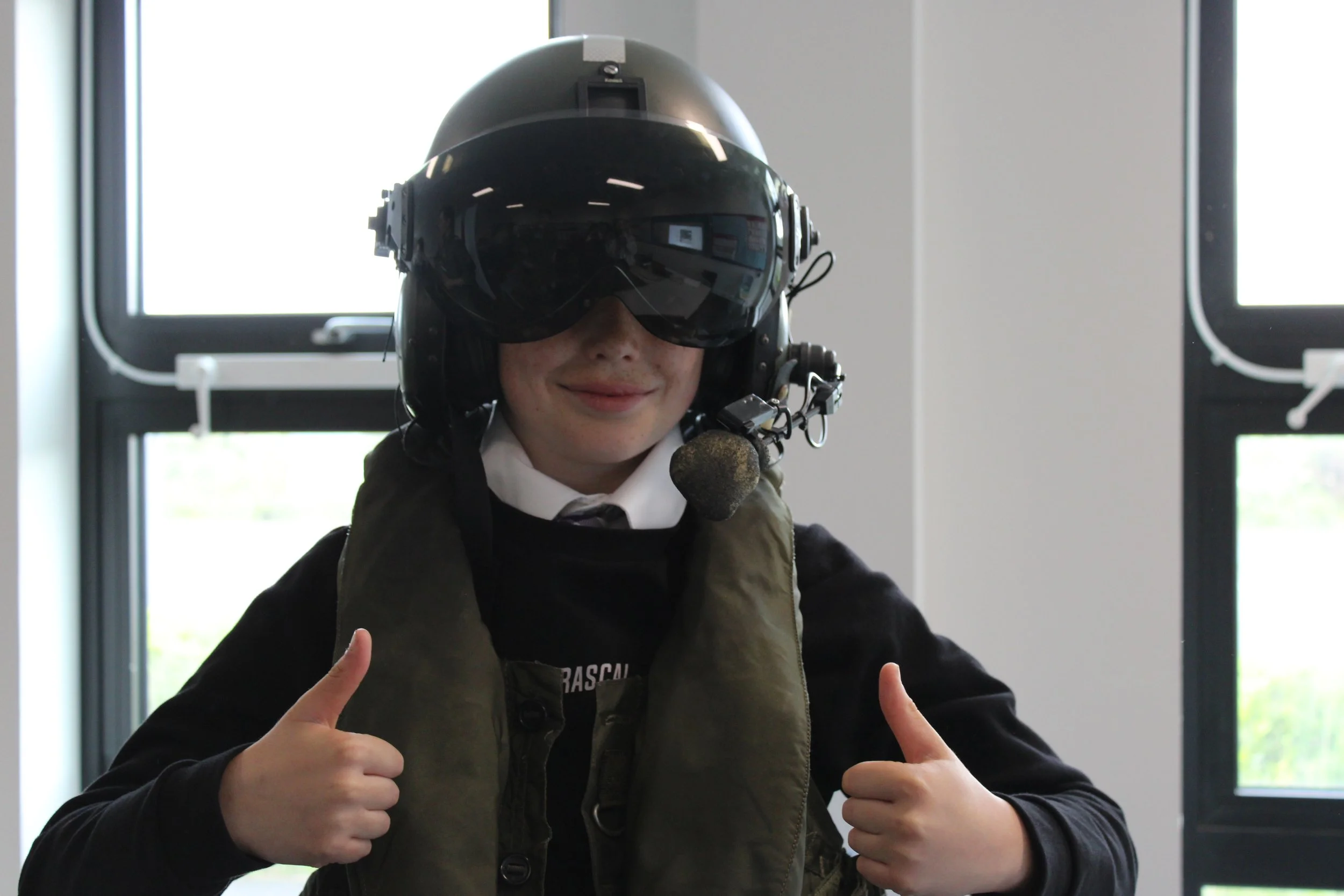 A participant tries on the RAF flight suit