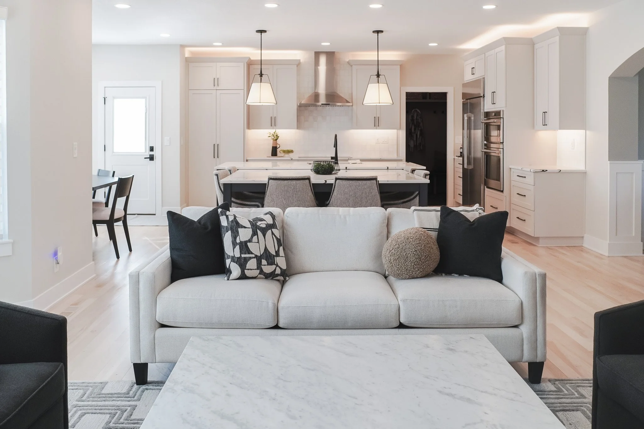 Every detail designed with intention &mdash; the family room furniture perfectly frames this beautiful custom kitchen, creating an open space that feels as welcoming as it looks. 🌿✨🛋
.
.
.
 #designtrends #interiordesigner #interior_and_living #home