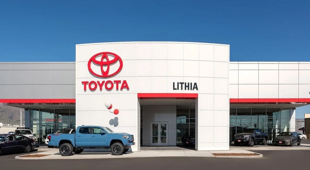 Exterior of Toyota Lithia dealership with several cars and the Toyota logo.
