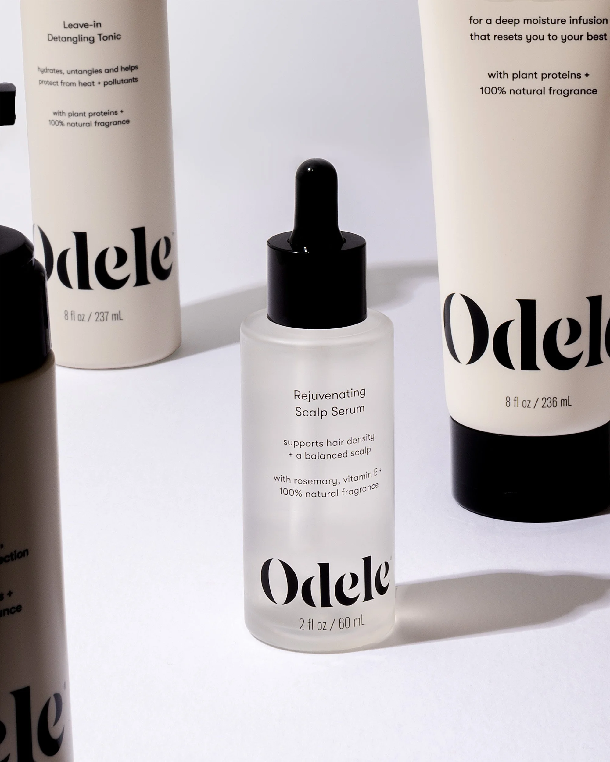 Still life product photography of hair care products on white background.