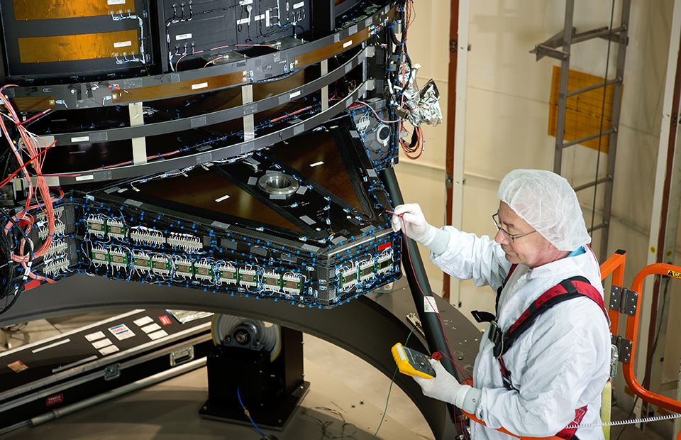  A NASA engineer works on the primary mirror assembly at the Goddard Space Flight Center 