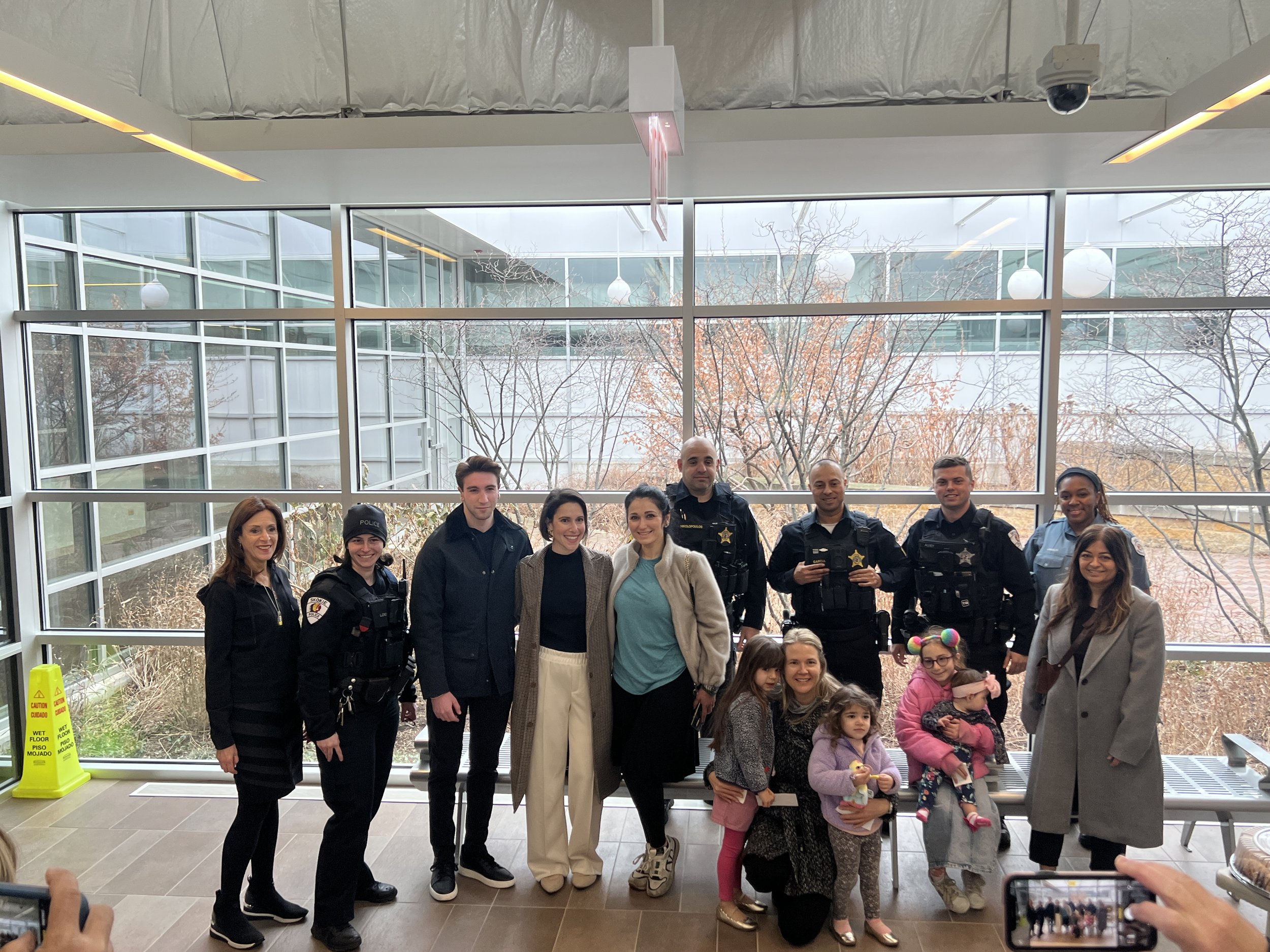 Annie with Trustee Alison Pure Slovin delivering food to the Skokie Police on Christmas.