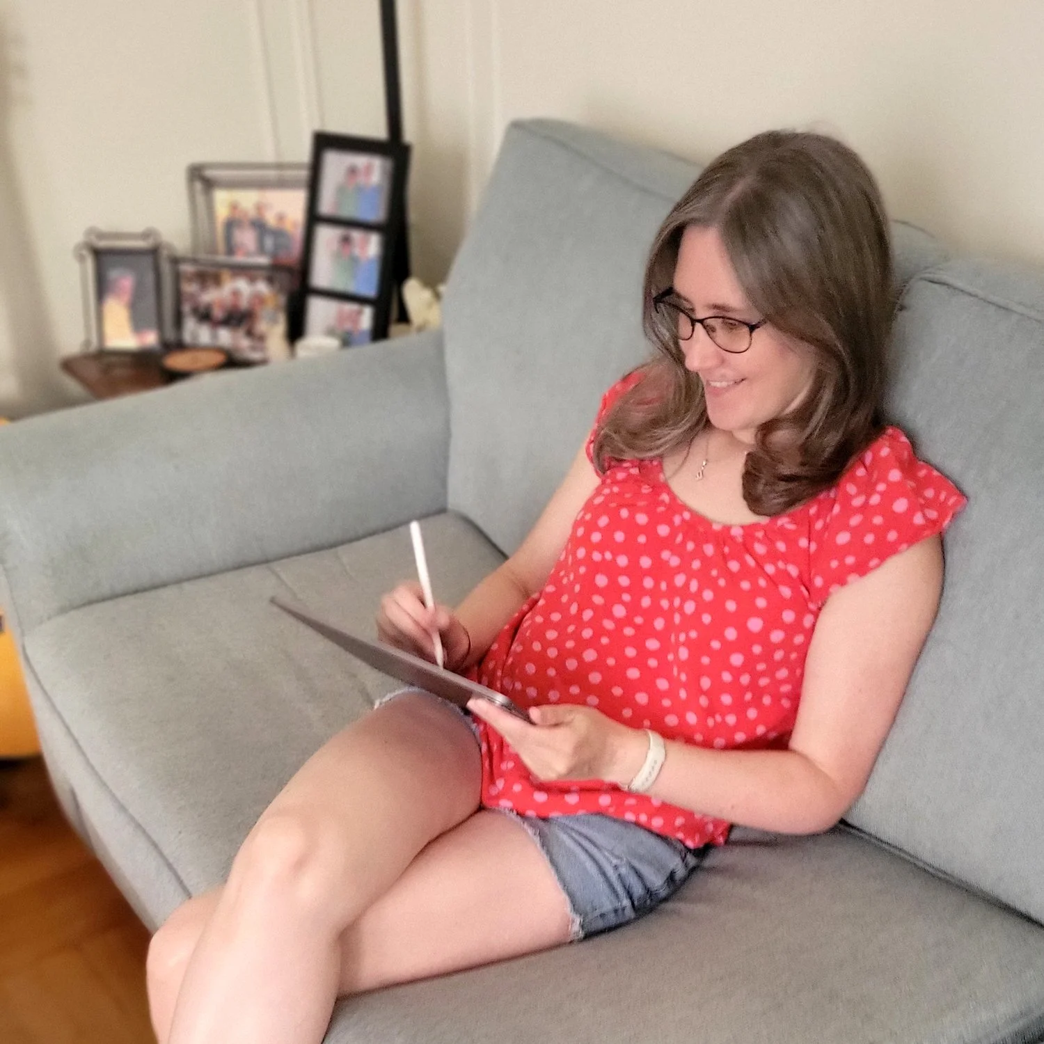 A photo of Jenny drawing on her iPad