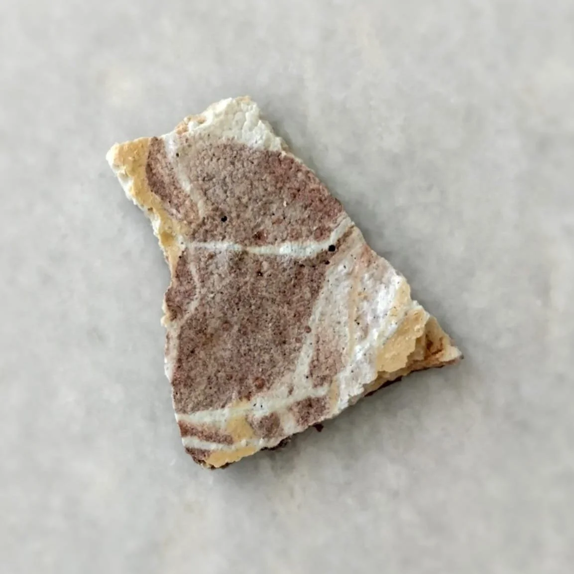 Edible sculptures: broken porous marble made from meringue, mineral tones from white and beige through grey and brown to liquorice and cacao by Veceto.