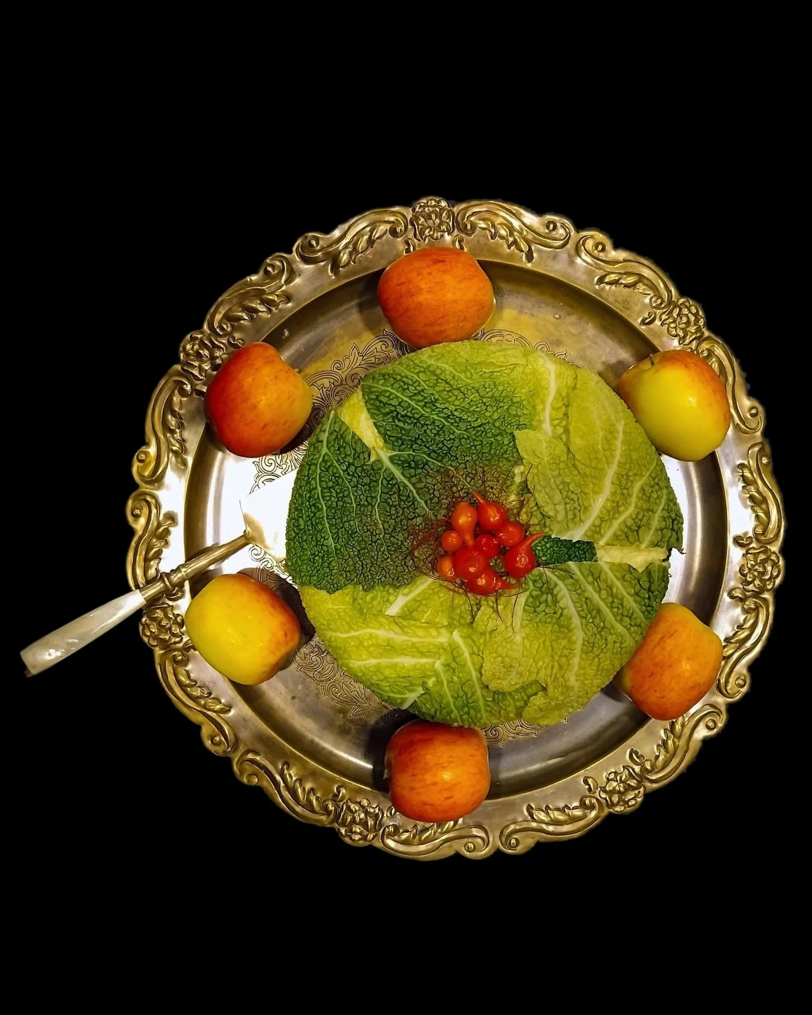 VECETO: sculptural cakes, savoy-leaf cake on a brass tray ringed by apples, cake server with mother-of-pearl handle.