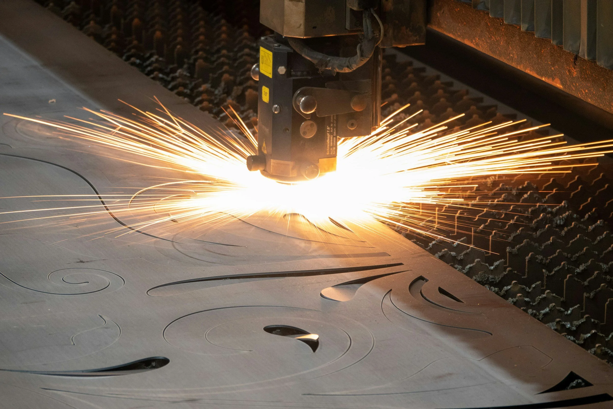 Fiber laser cutting shapes out of sheet metal