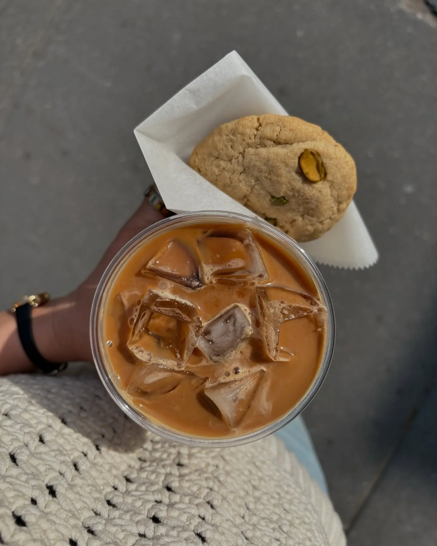 only way to enjoy the sun is an iced coffee; pairing so well with our new pistachio chai butter cookie 🍪 ☕️