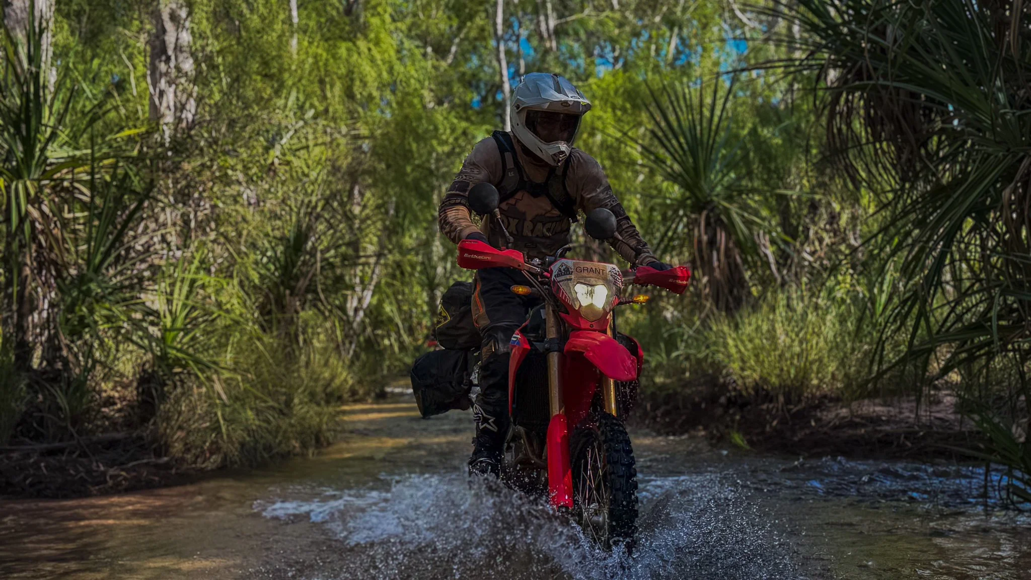 Cairns to Darwin motorcycle tour with riding and navigating river crossing in outback terrain