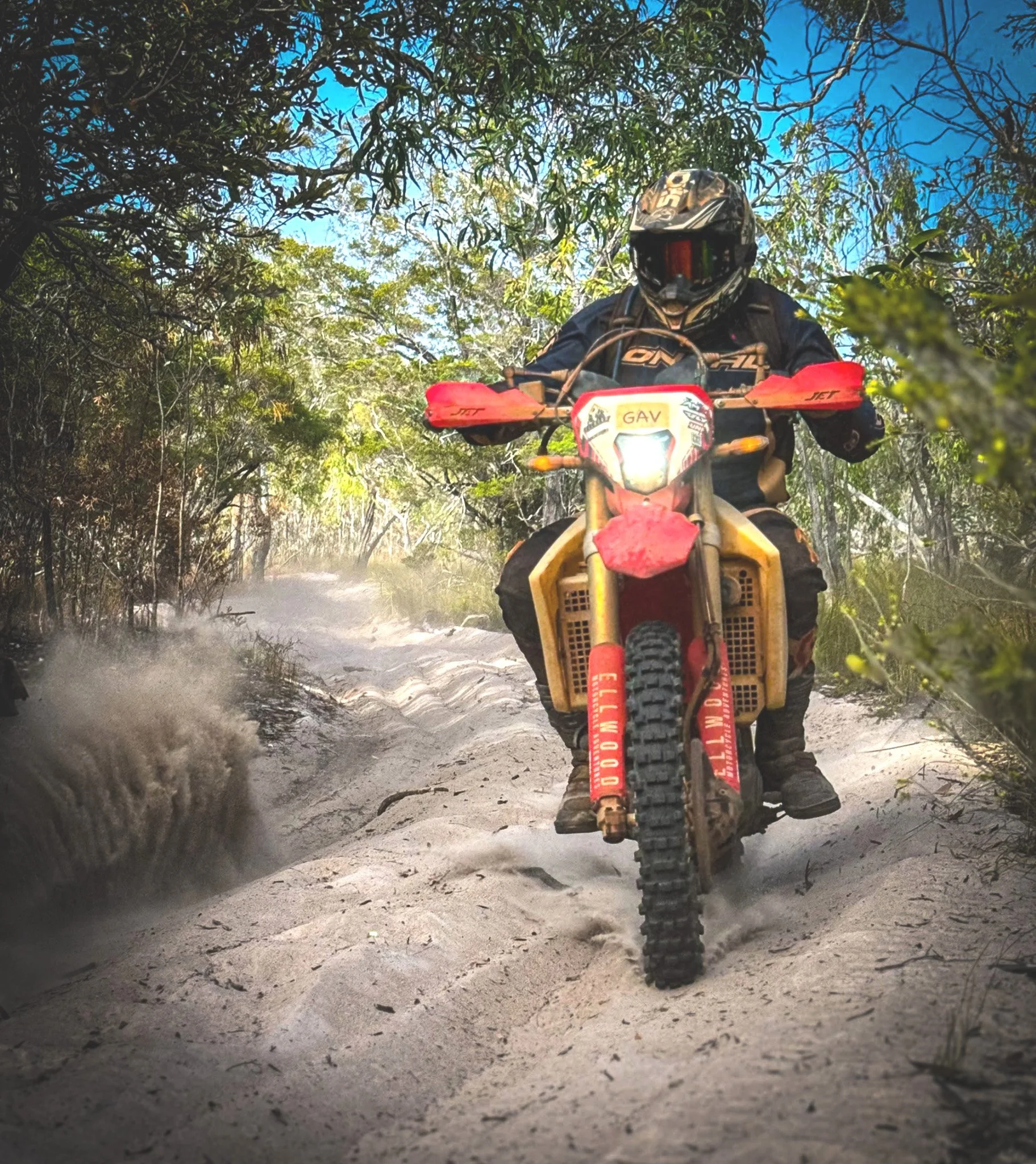 Rider on a dirt bike navigating sandy single track on a 1 to 5 day motorcycle tour near Cairns in Far North Queensland