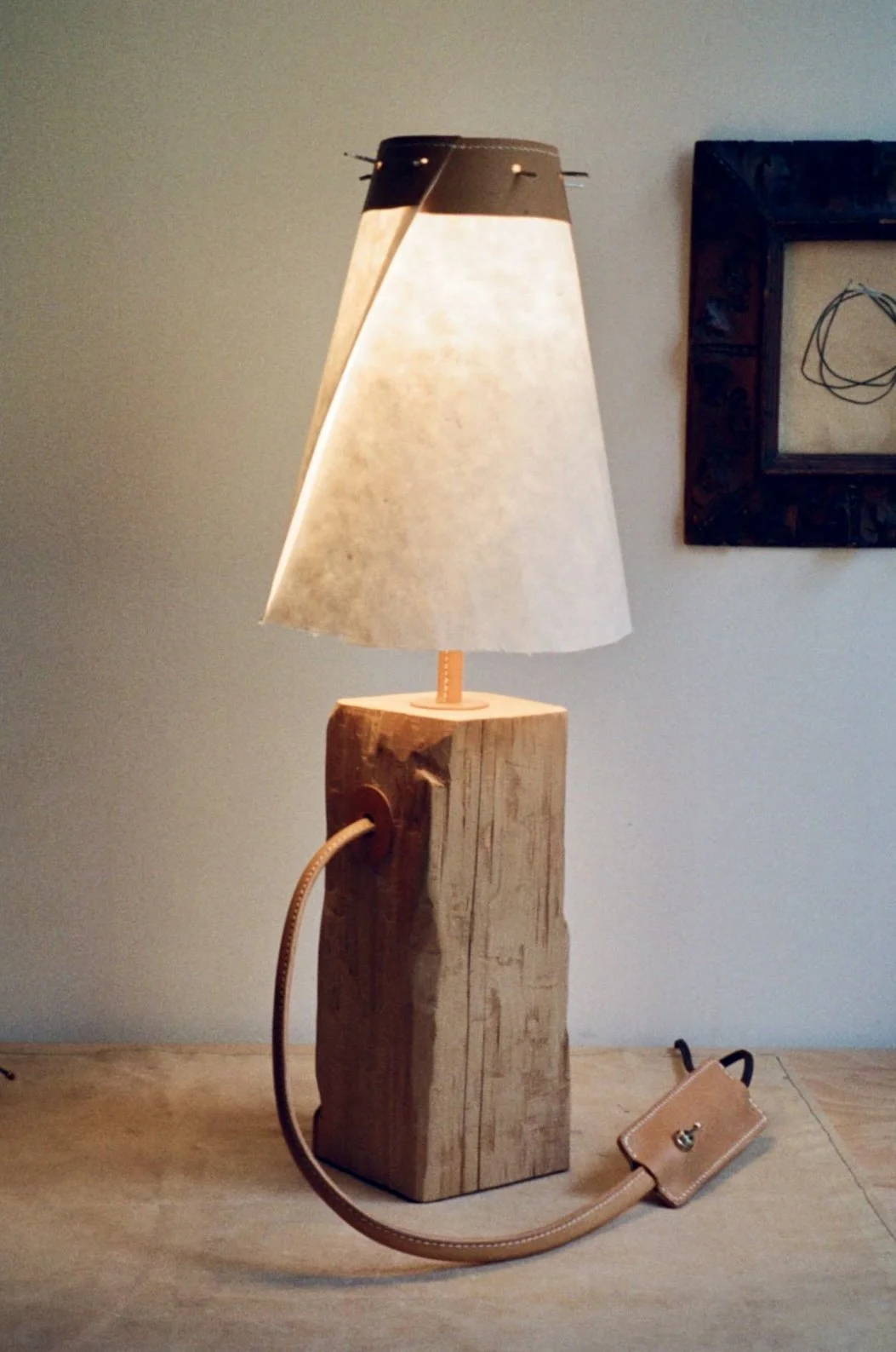 Salvaged beam (Hand hewn with hatchet), Wrapped leather cord, Pewter twigs, Mulberry Washi paper, Leather