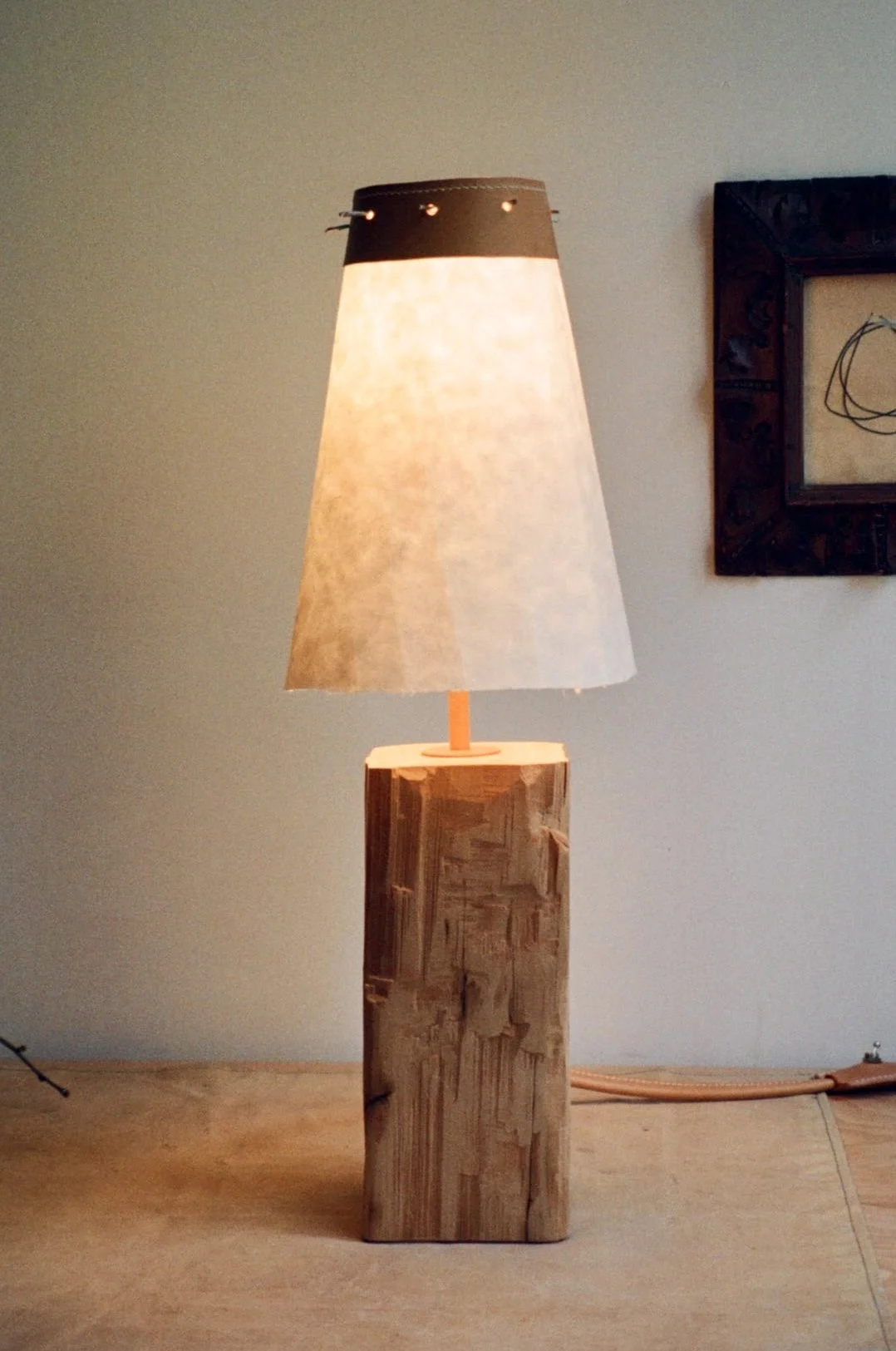 Salvaged beam (Hand hewn with hatchet), Wrapped leather cord, Pewter twigs, Mulberry Washi paper, Leather