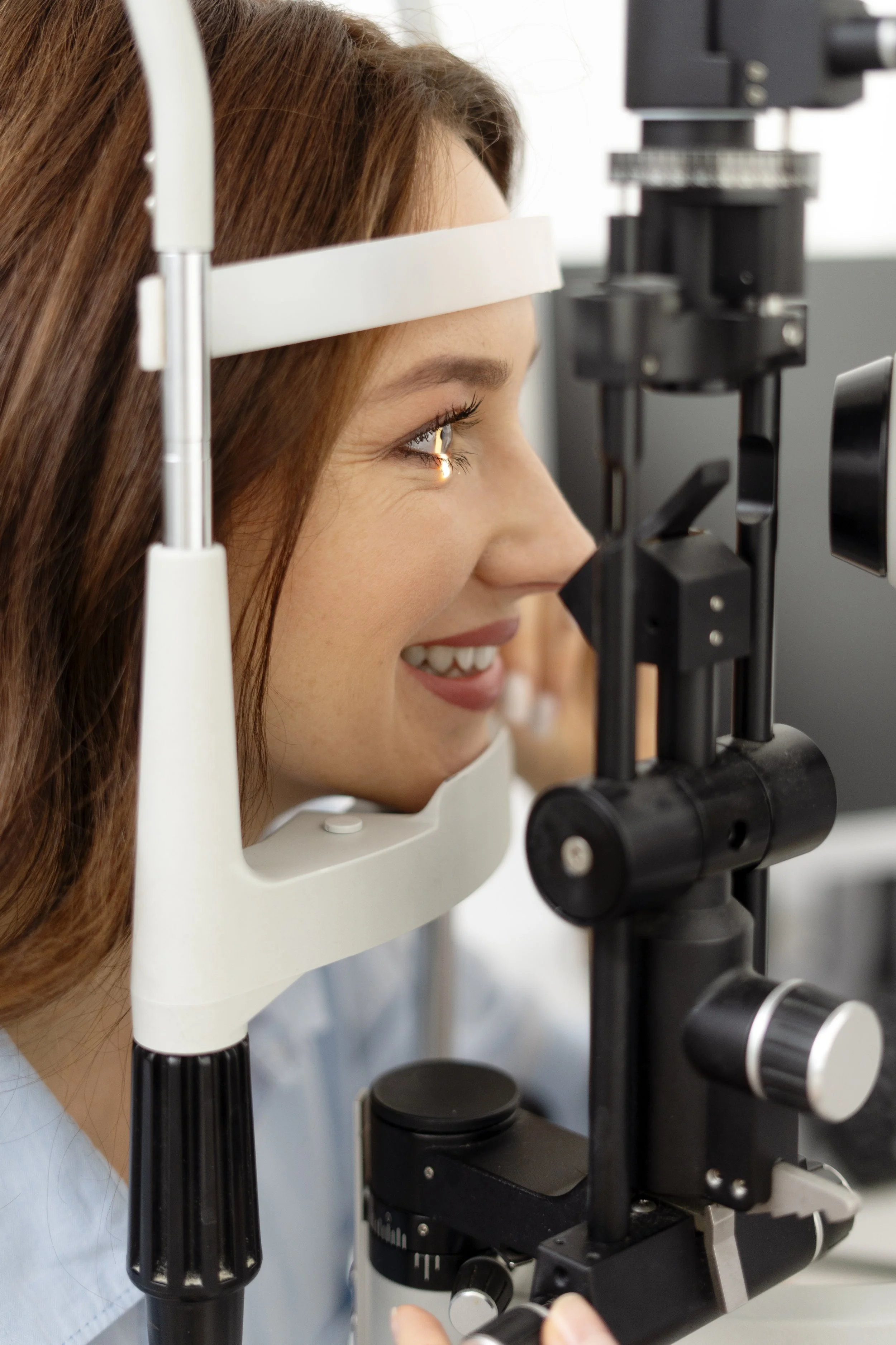 close-up-of-smiling-young-woman-taking-eye-care-2023-11-27-04-58-30-utc.jpg