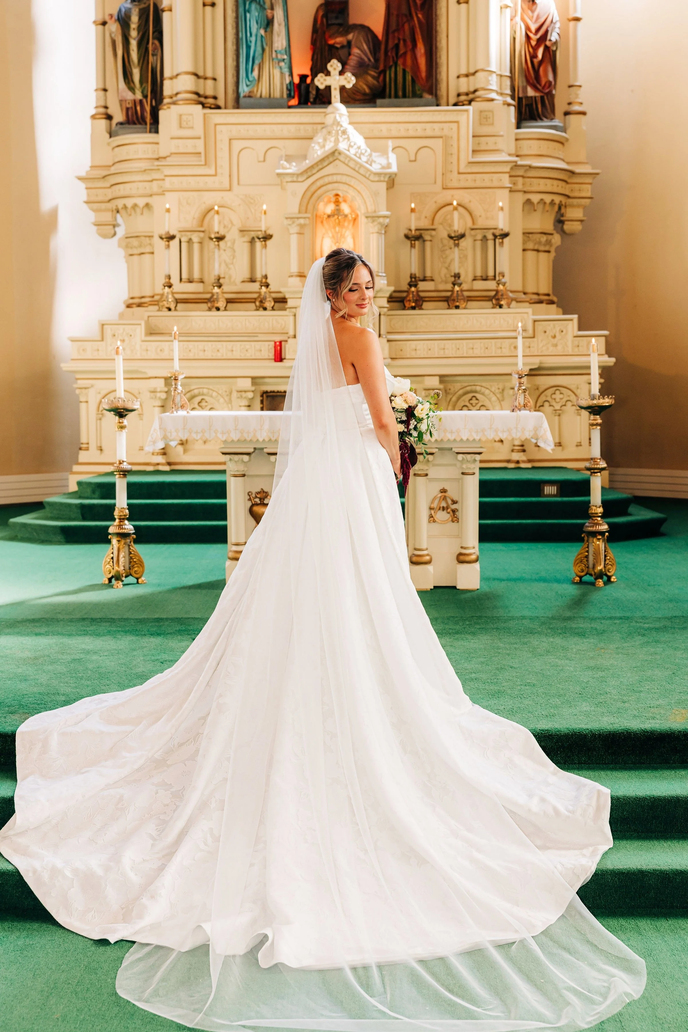 Bridal Alteration: Rolled edge hem, take in sides, buttons, pleats, bustle, train skirt enclosed hem, and boning. 