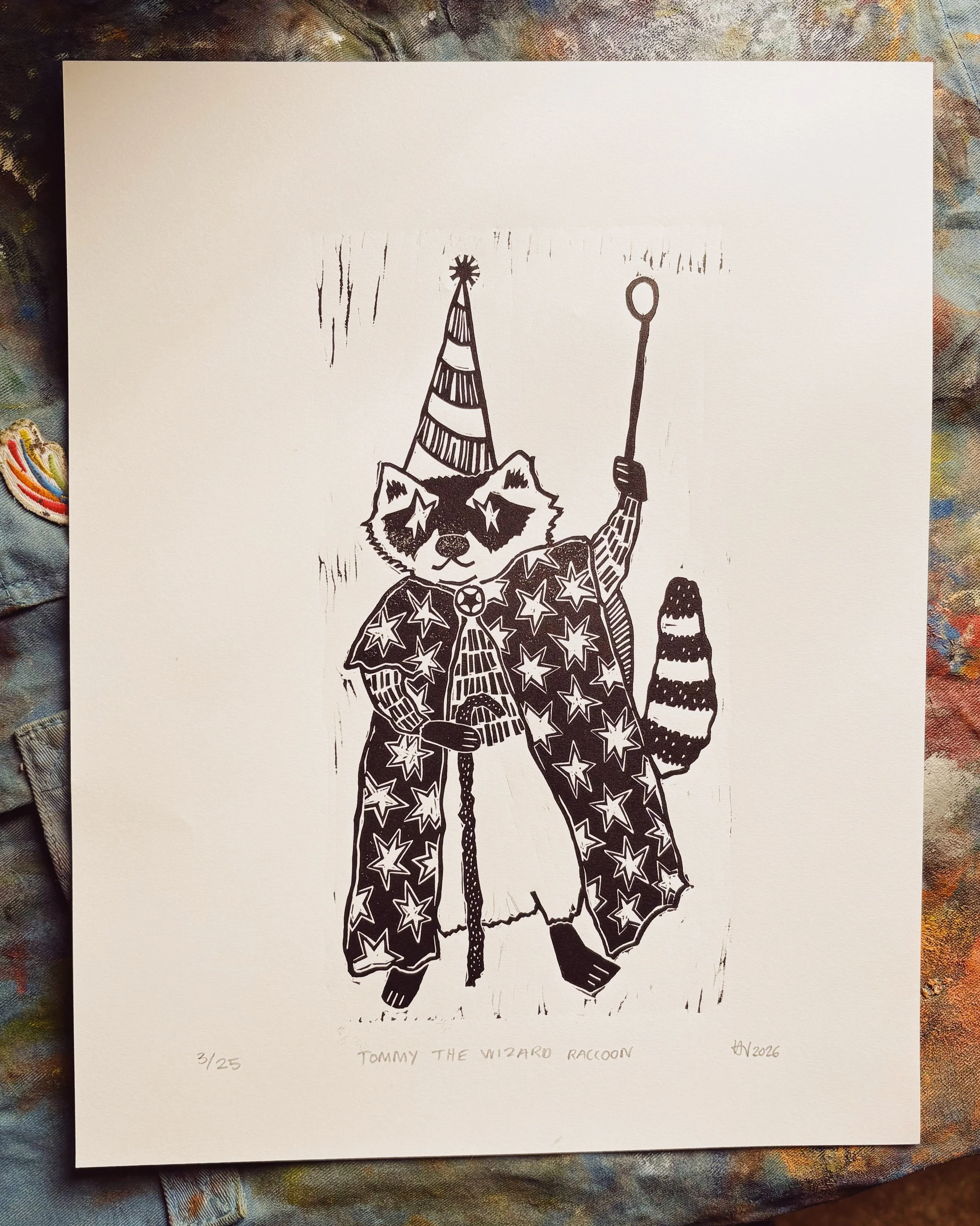 in case you hadn&rsquo;t notice, my raccoon print got some major updates including a new name!! ⭐ let me introduce you to TOMMY THE WIZARD RACCOON! 🌀🔮

do we like the new one? or was the old one better? be honest