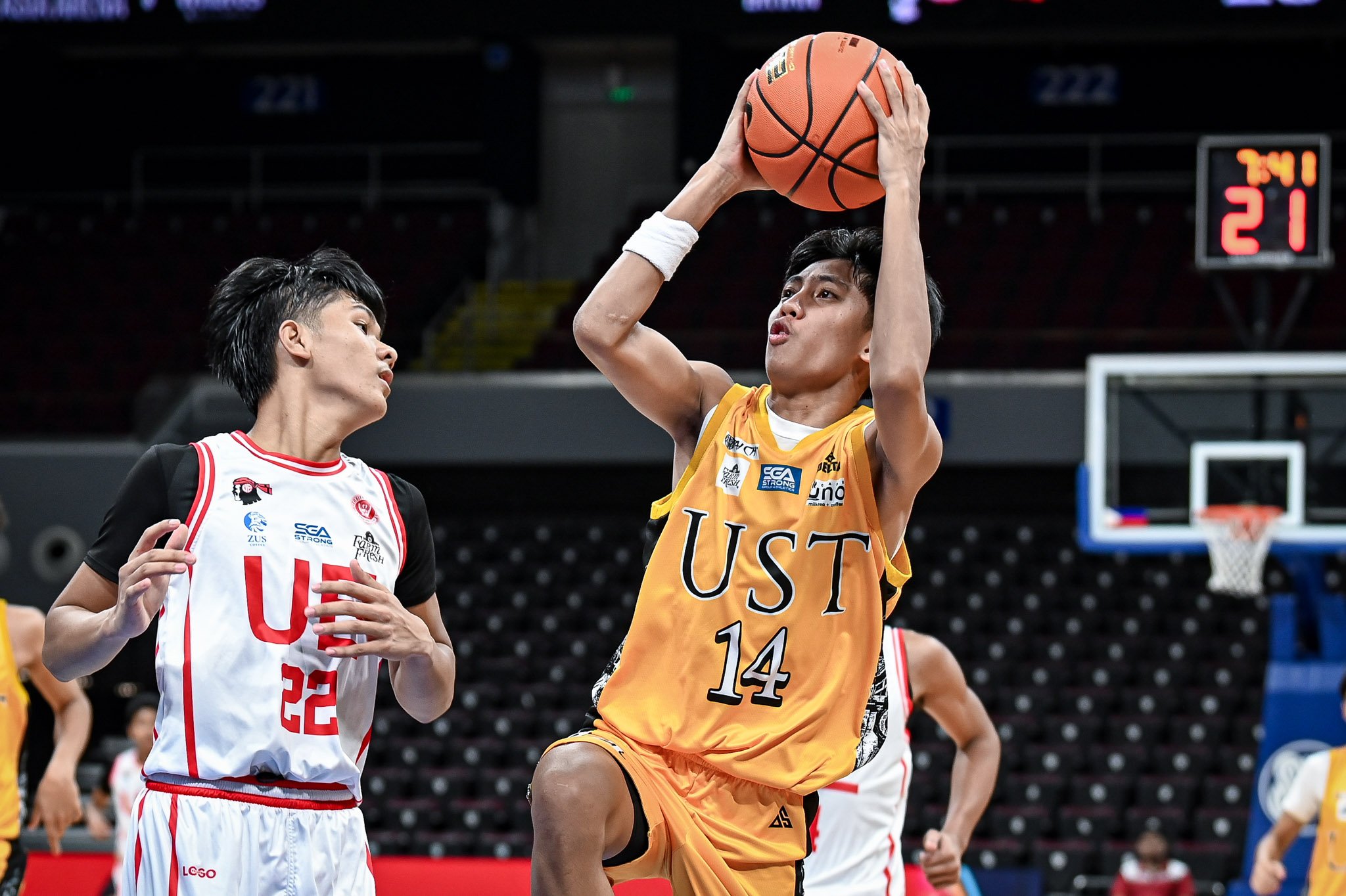 UST HOLDS OFF UE IN GRITTY BATTLE, TIES FOR SECOND